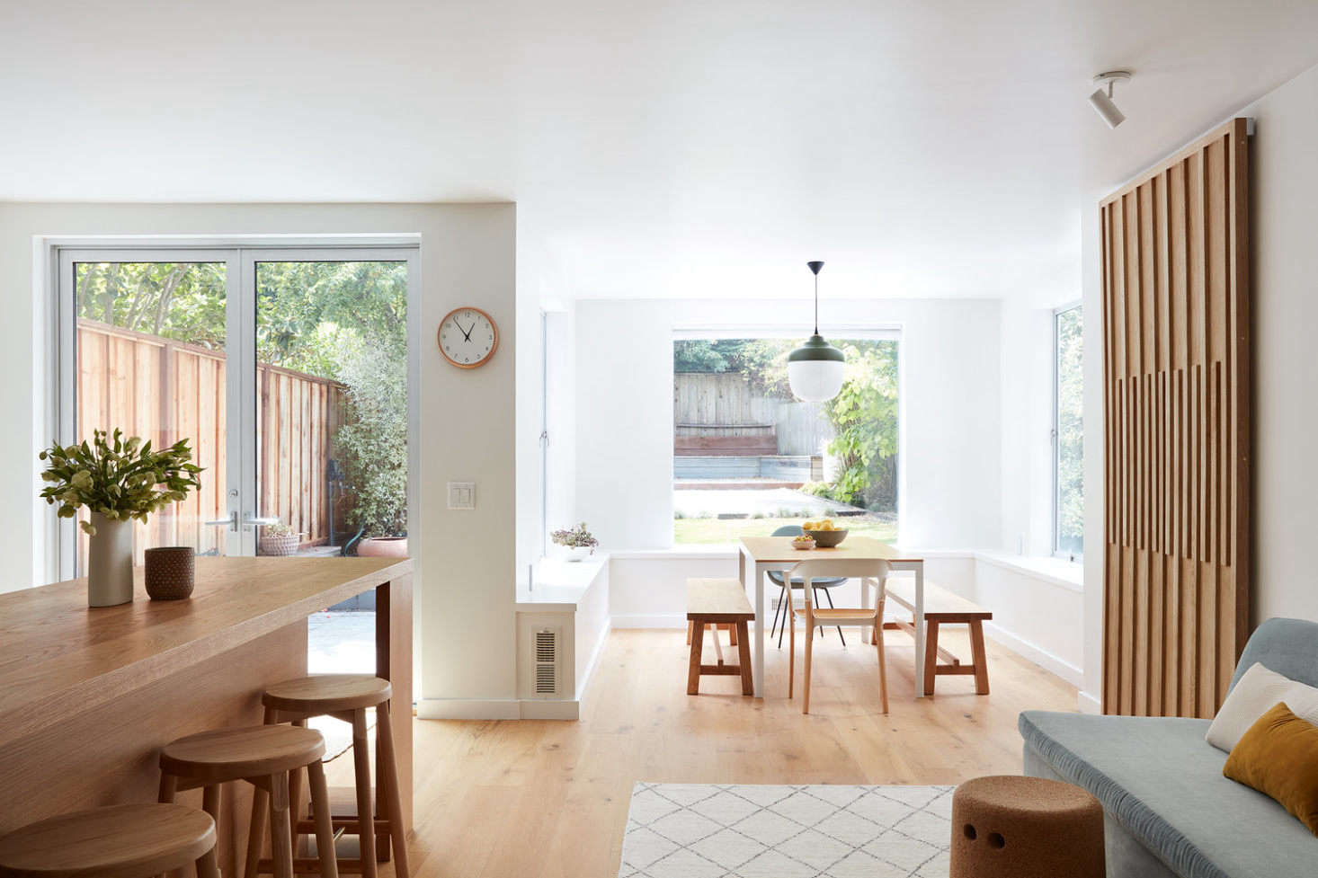 The kitchen is open to the living and dining areas. The walls are painted Benjamin Moore