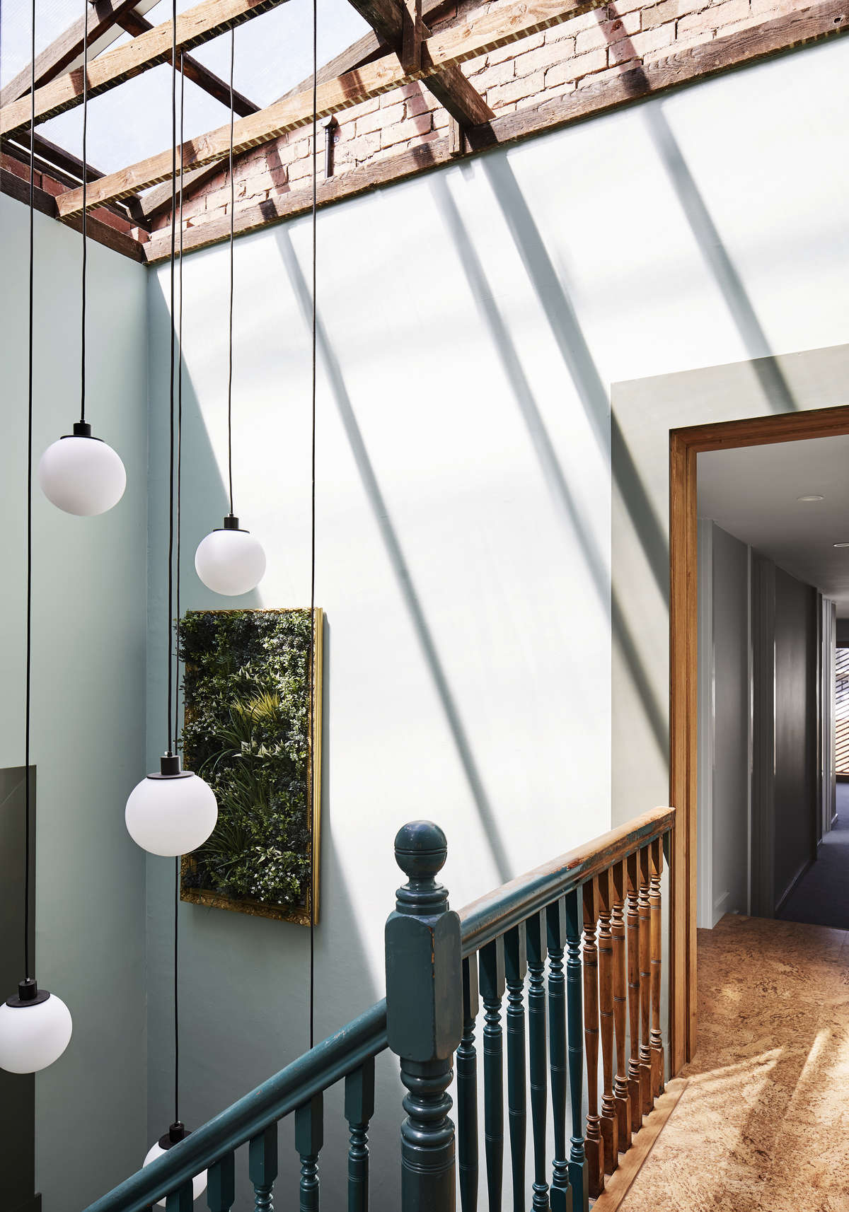 Just beyond the stairs are two bedrooms; below is the store and workshop. About the half-painted railing: 