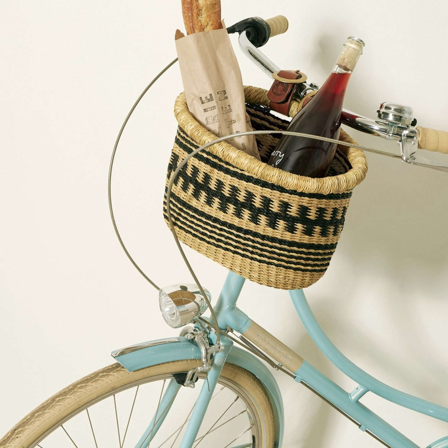 The handwoven, fair-trade Medium Bicycle Basket ($80), also by Baba Tree, straps sturdily to the front of a bike for carrying farmer’s market hauls, picnics, and other summer essentials.