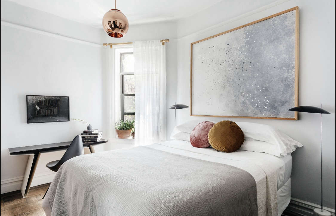 The Clam Floor Lamps flanking the bed are by Avionstudio. 