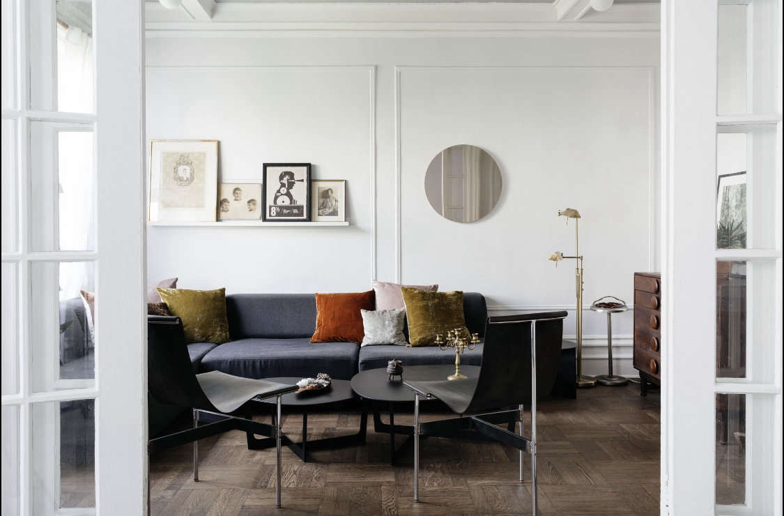 To give the pre-war apartment a more modern feel, Delia had all the walls and millwork painted a super-pale gray. 