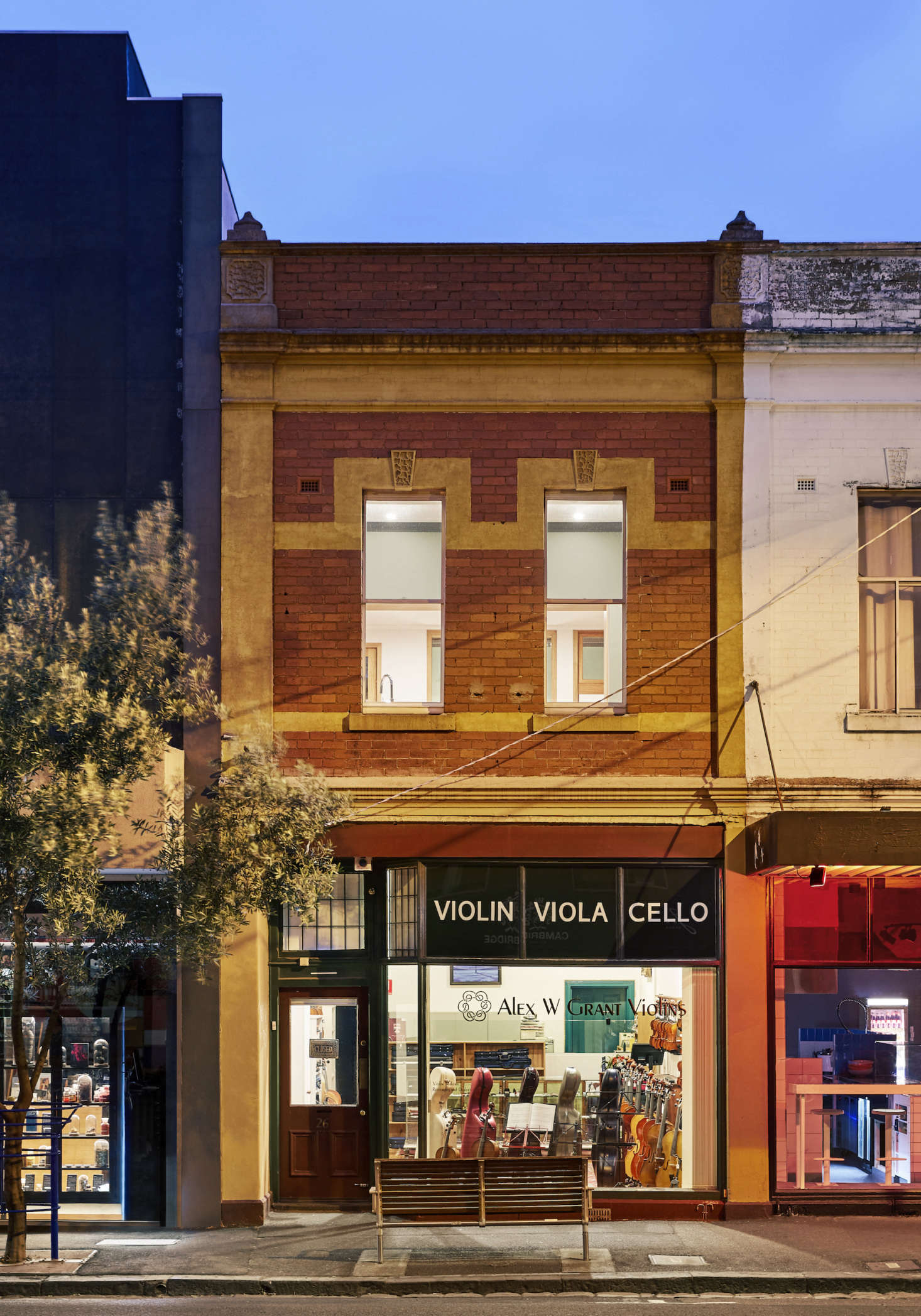 The front of the building, with the store on the street level and the couple