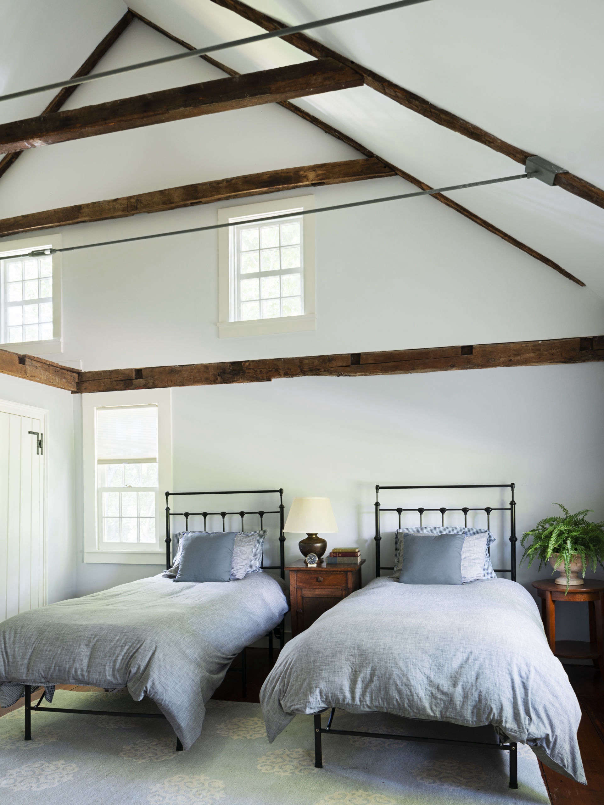 A double-height ceiling and exposed rafters in the boys