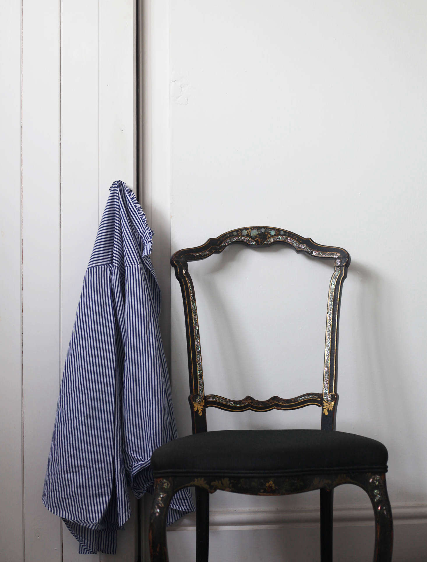 Victoria and Phil converted the attic into their bedroom suite. This mother-of-pearl-inlaid chair is in their dressing room.