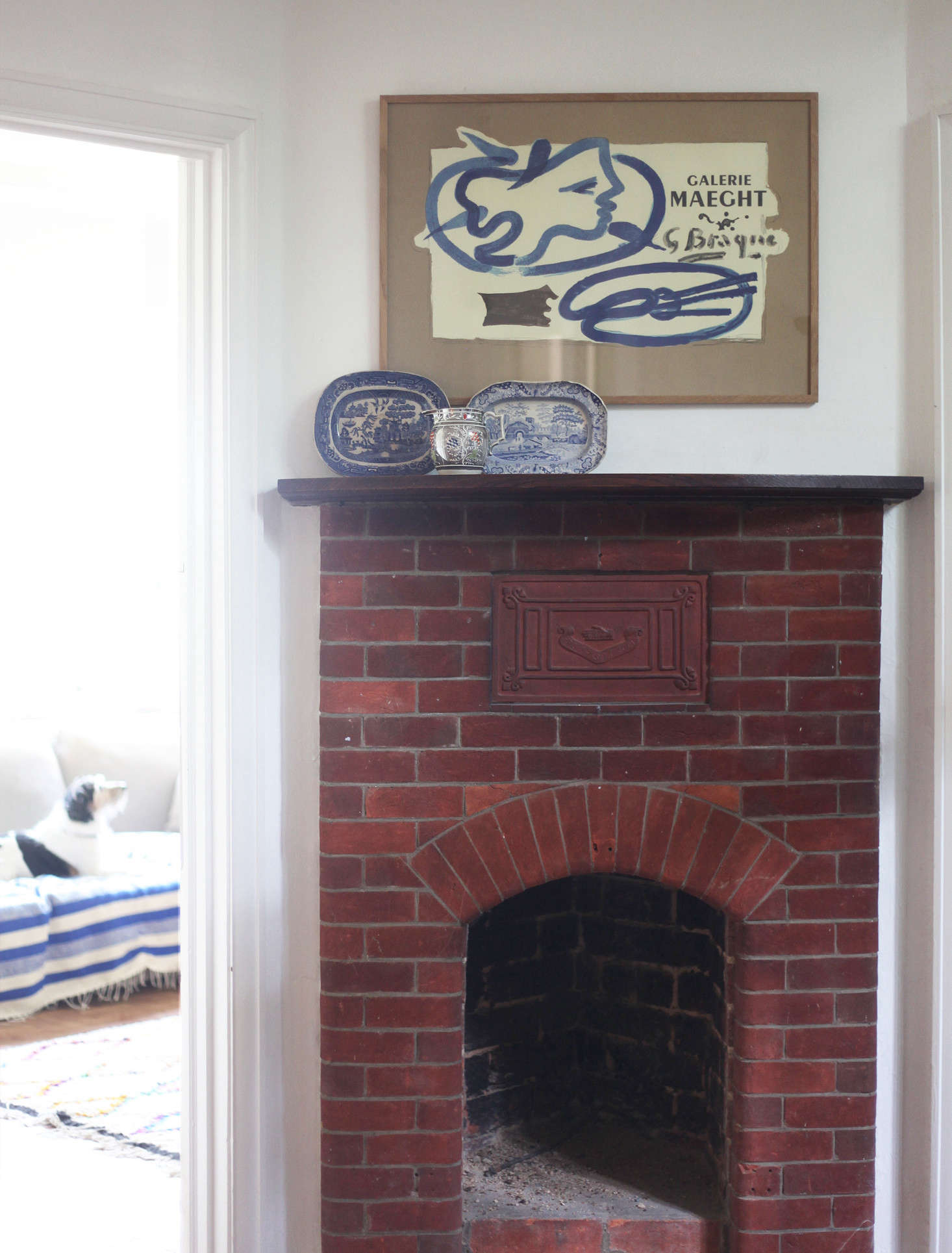 The brick fireplace in the hall was once used to warm guests on arrival.