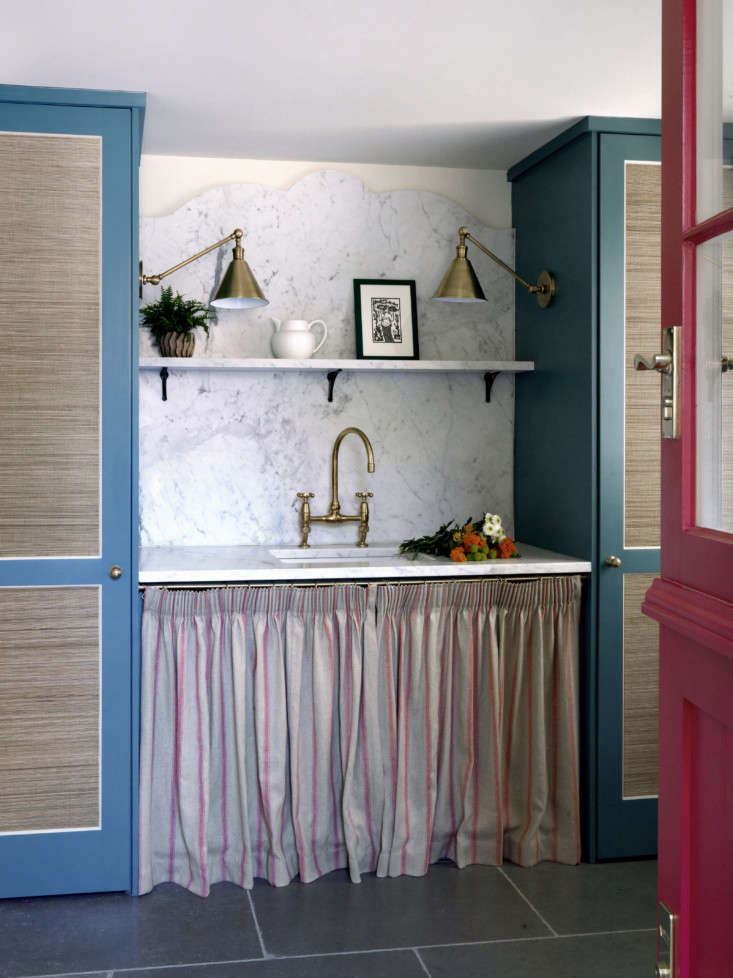 in a sussex cottage, beata heuman skirted the utility sink with striped linen a 16