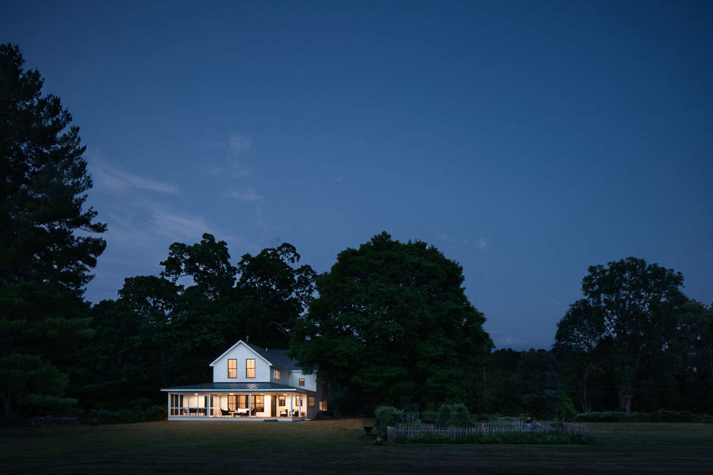 At twilight, the house looks like a Maxfield Parrish painting.