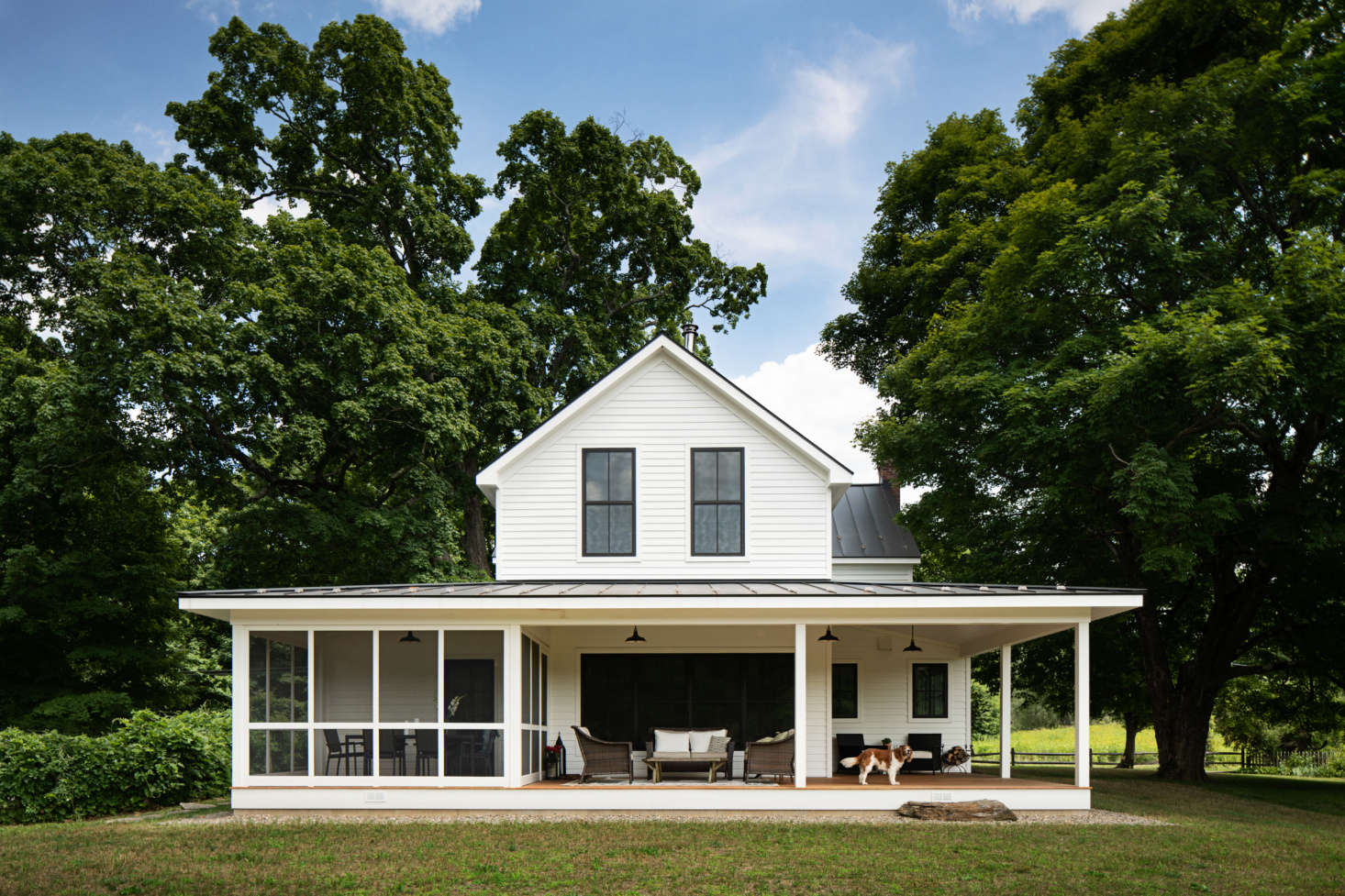 The back porch, both screened and open-air, serves as the family