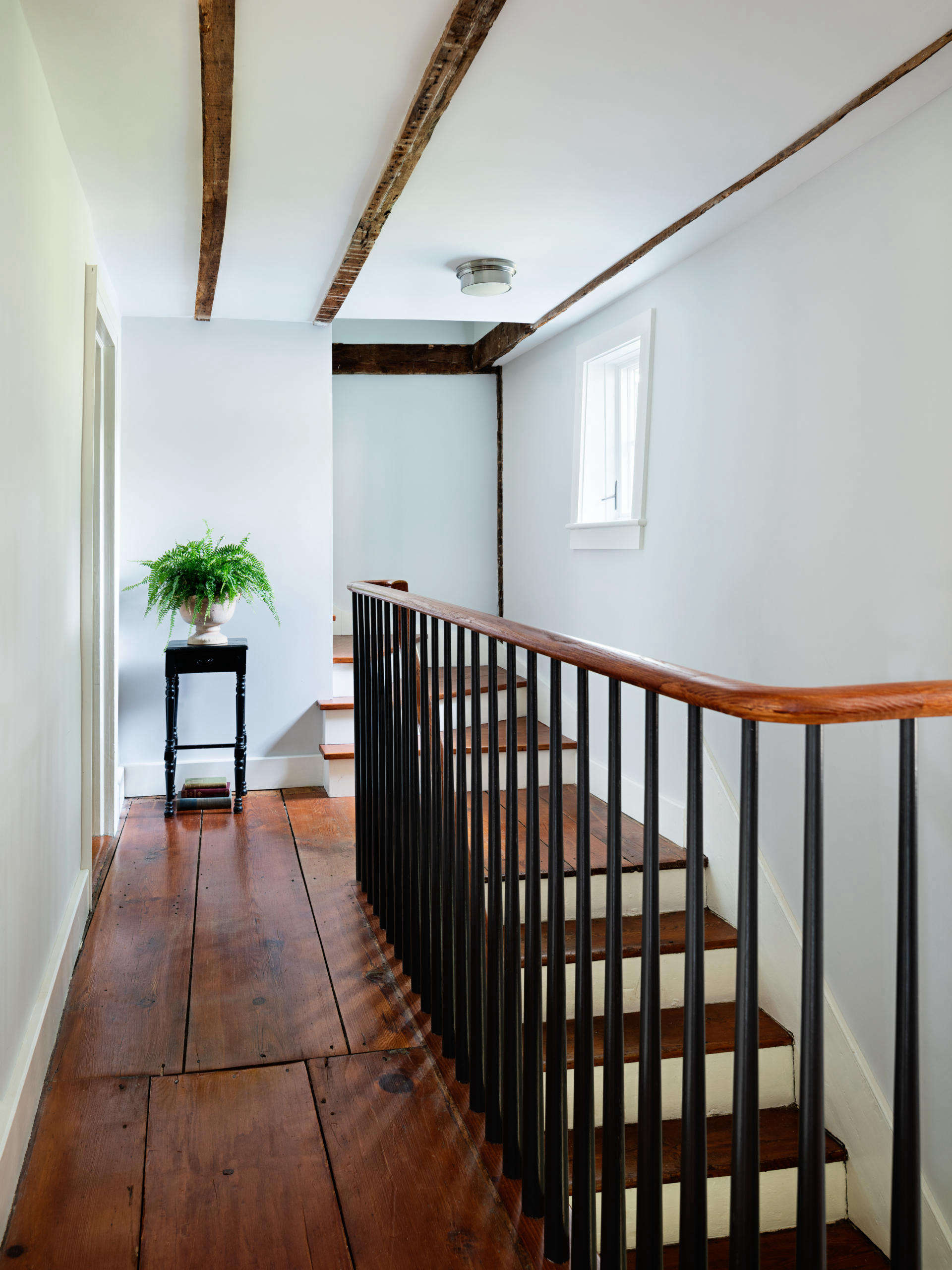 The house retains its original stair (with a new railing in place of a Sheetrock wall) and extra-wide floorboards.