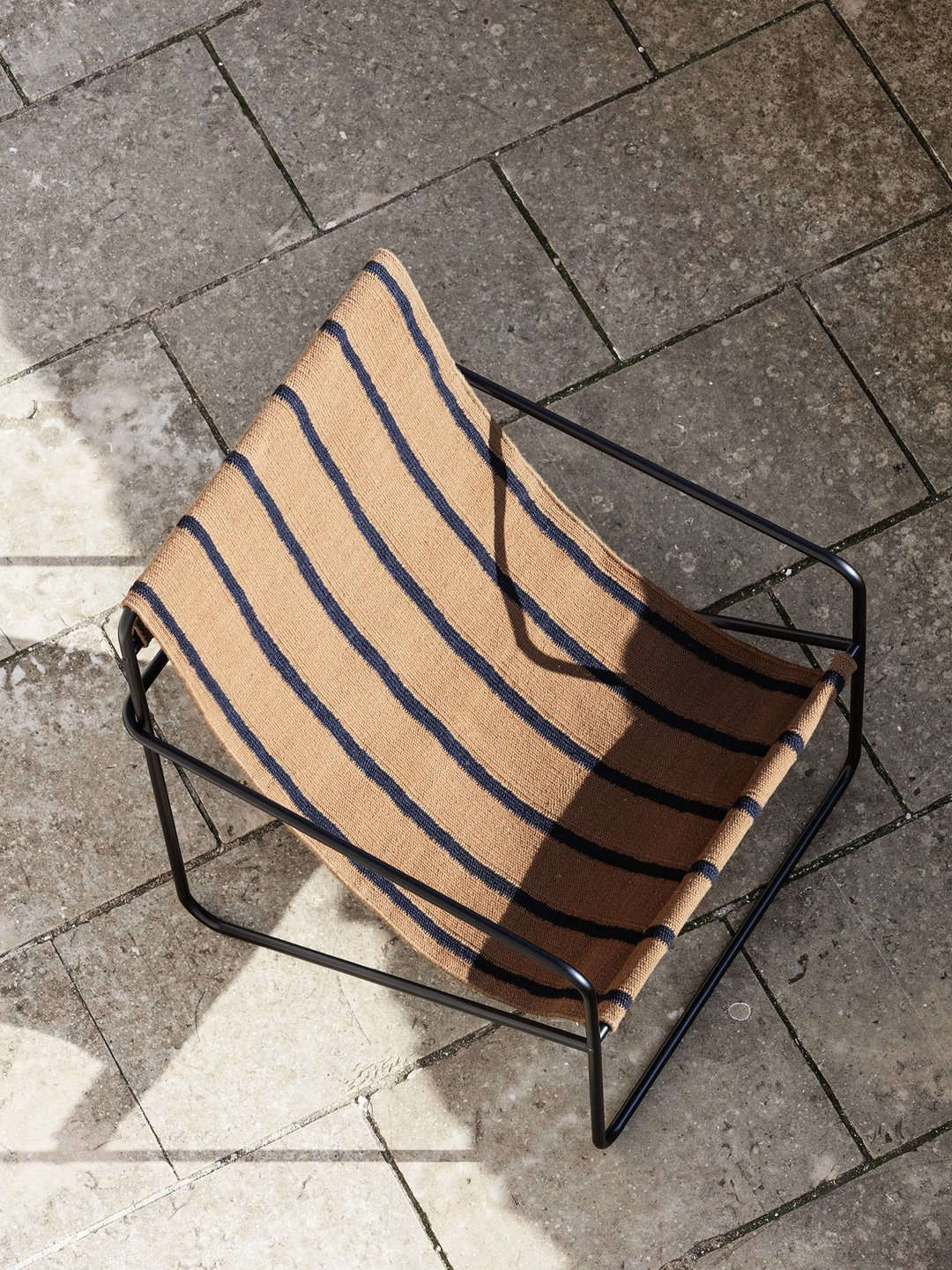 A detail of the Desert Lounge Chair in Black/Stripes; $345 from Lekker Home.