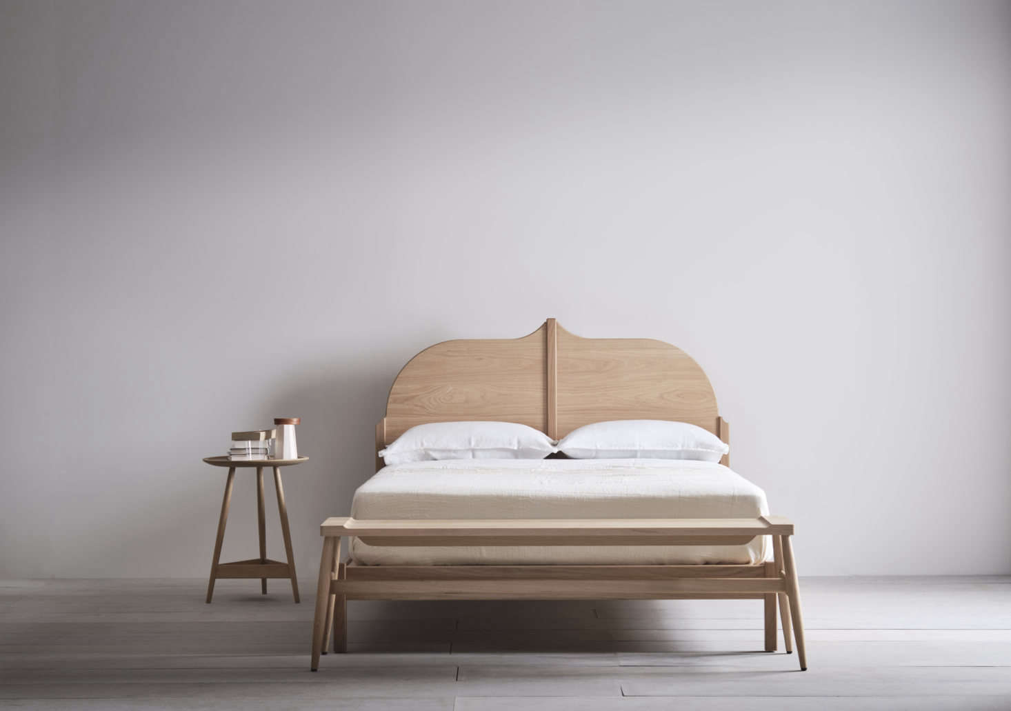 In addition to American black walnut, the frames are offered in European oak with a white oil finish. This Christo Bed is UK king size (which is the equivalent of an American queen.)