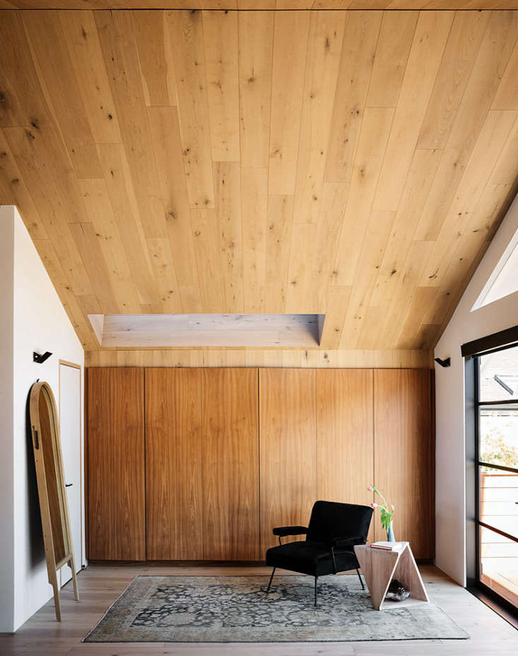 the dressing area, lined with oak closets, leads to a deck. 24