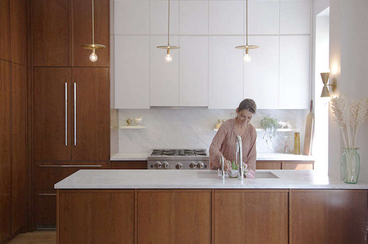 the sink in the former kitchen was awkwardly wedged in the corner next to the w 18