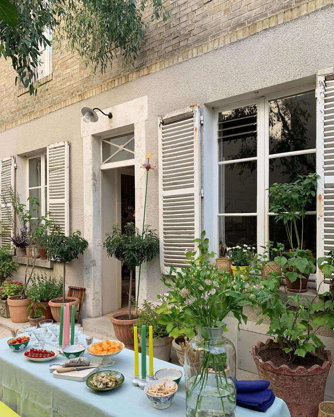 Dinner outdoors—colorful tapers included.