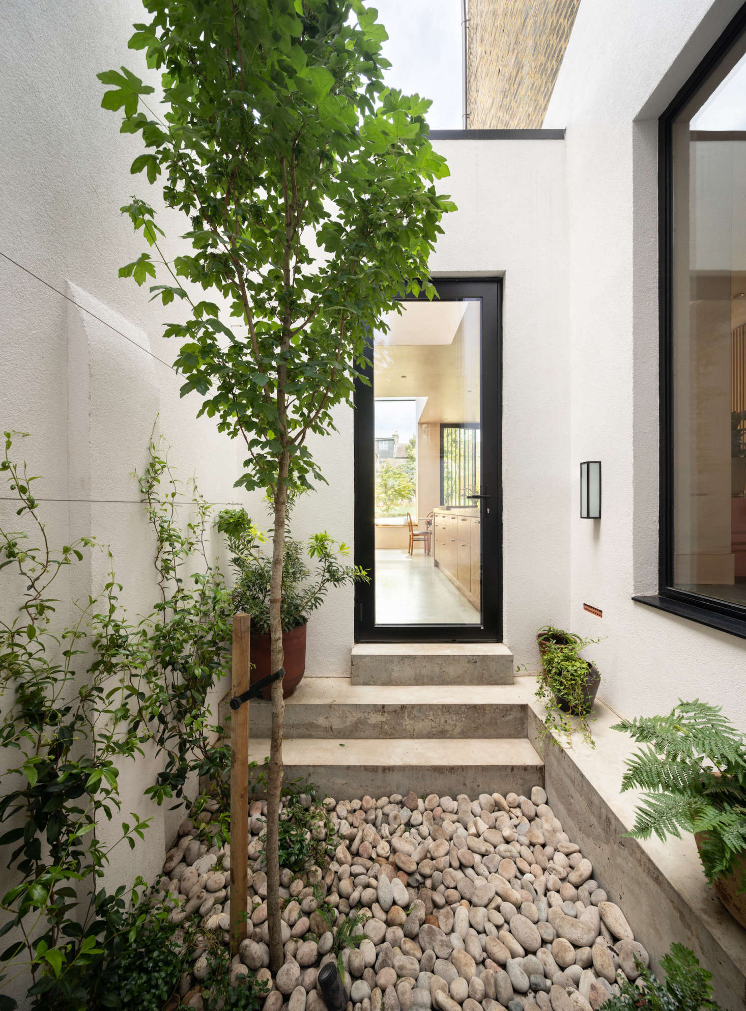 The view from the tsubo-niwa into the kitchen. The door is by Josko. 