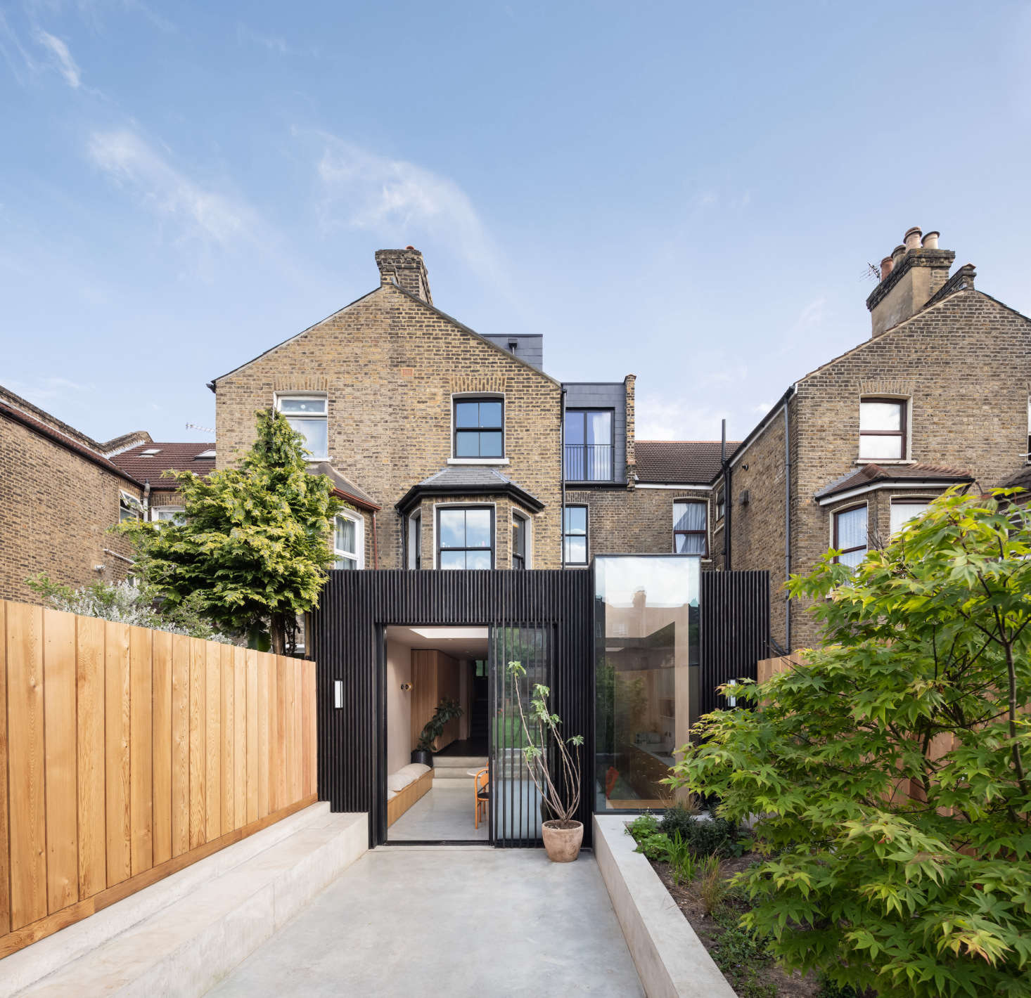 In a home that celebrates smooth transitions and meaningful connections, naturally the indoor bench extends into an outdoor one in the yard.