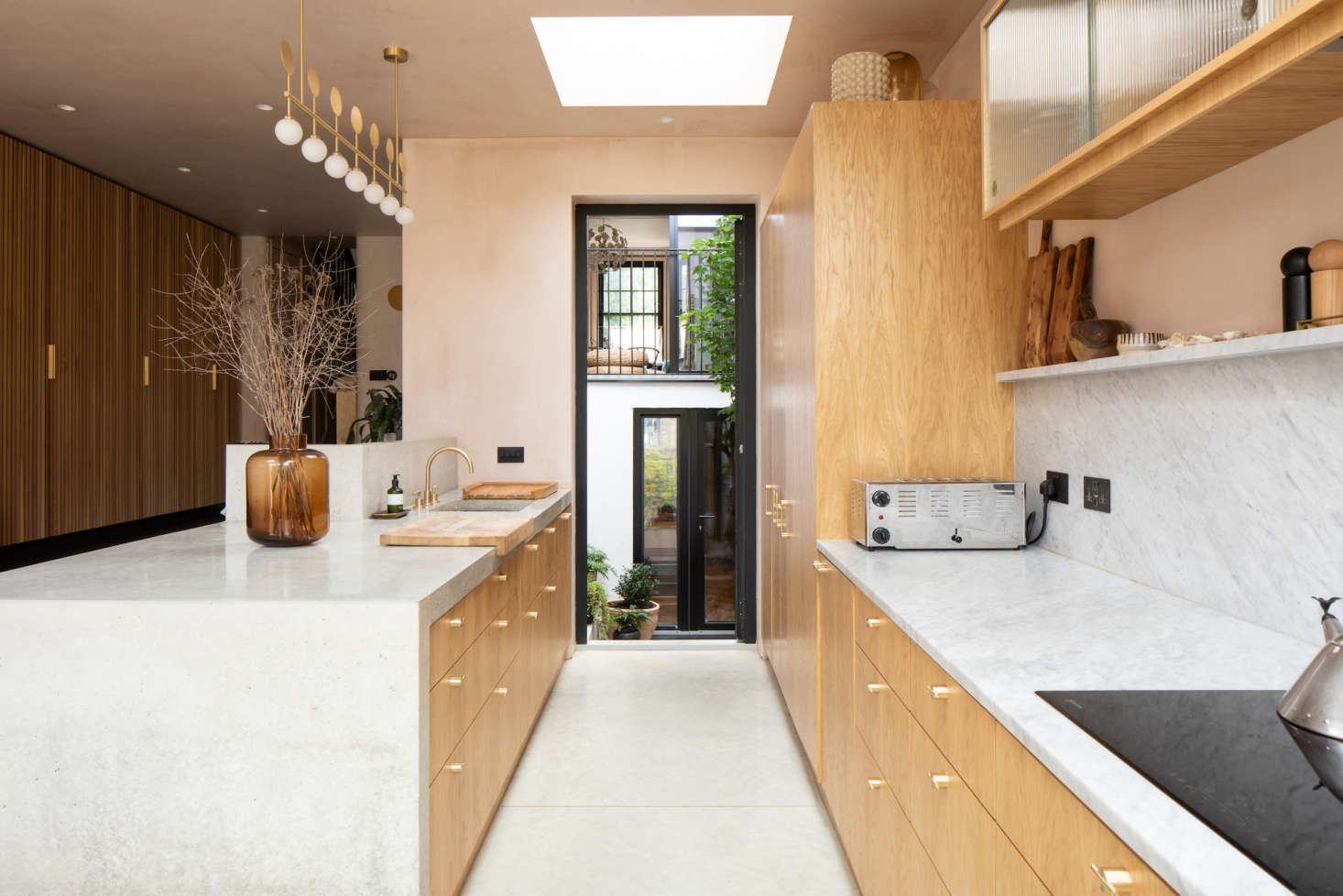 A steel and glass door opens into the interior courtyard.