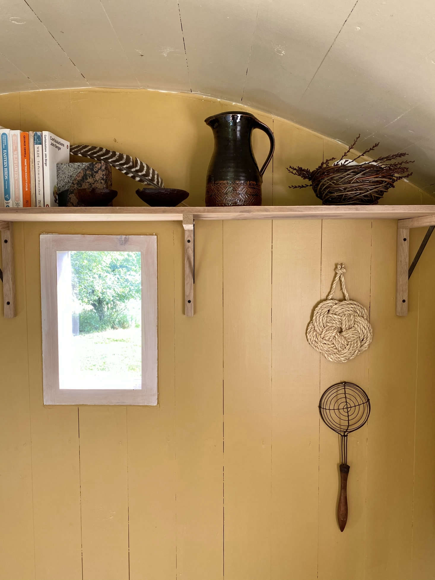 An antique egg dipper hangs as sculpture.