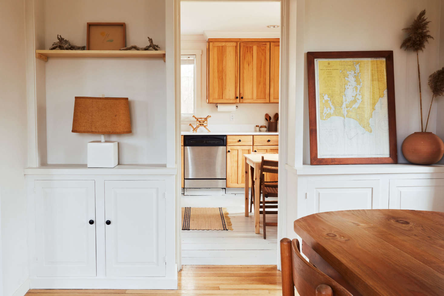 Built-ins divide living room from kitchen. On the shelves, says Sean: 
