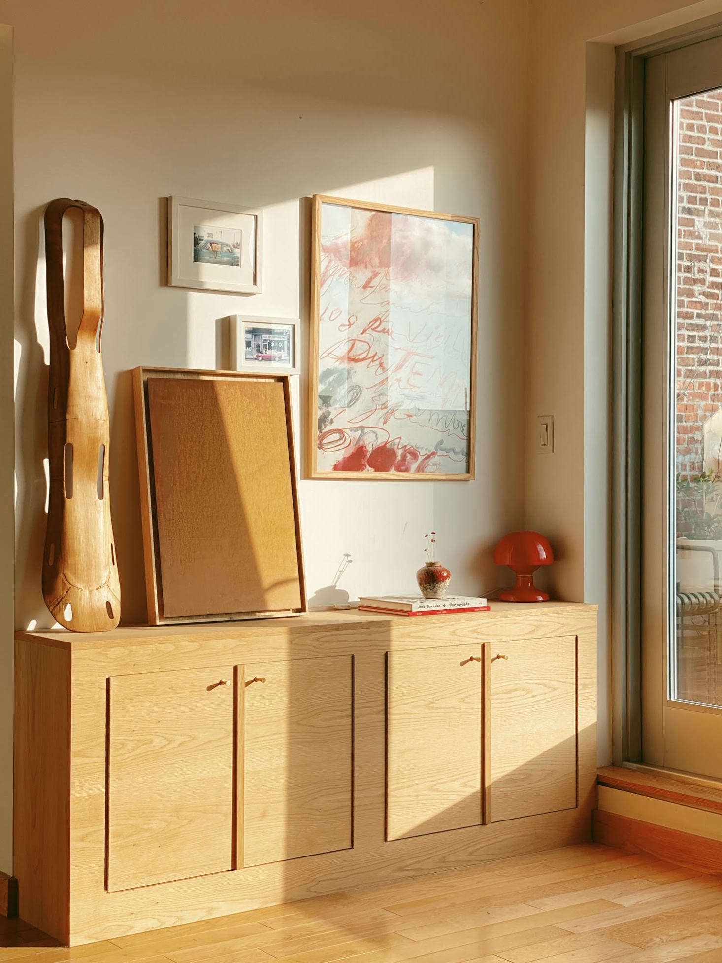 To the right are glass doors that lead to the terrace, where Clément cut the plywood to length. 