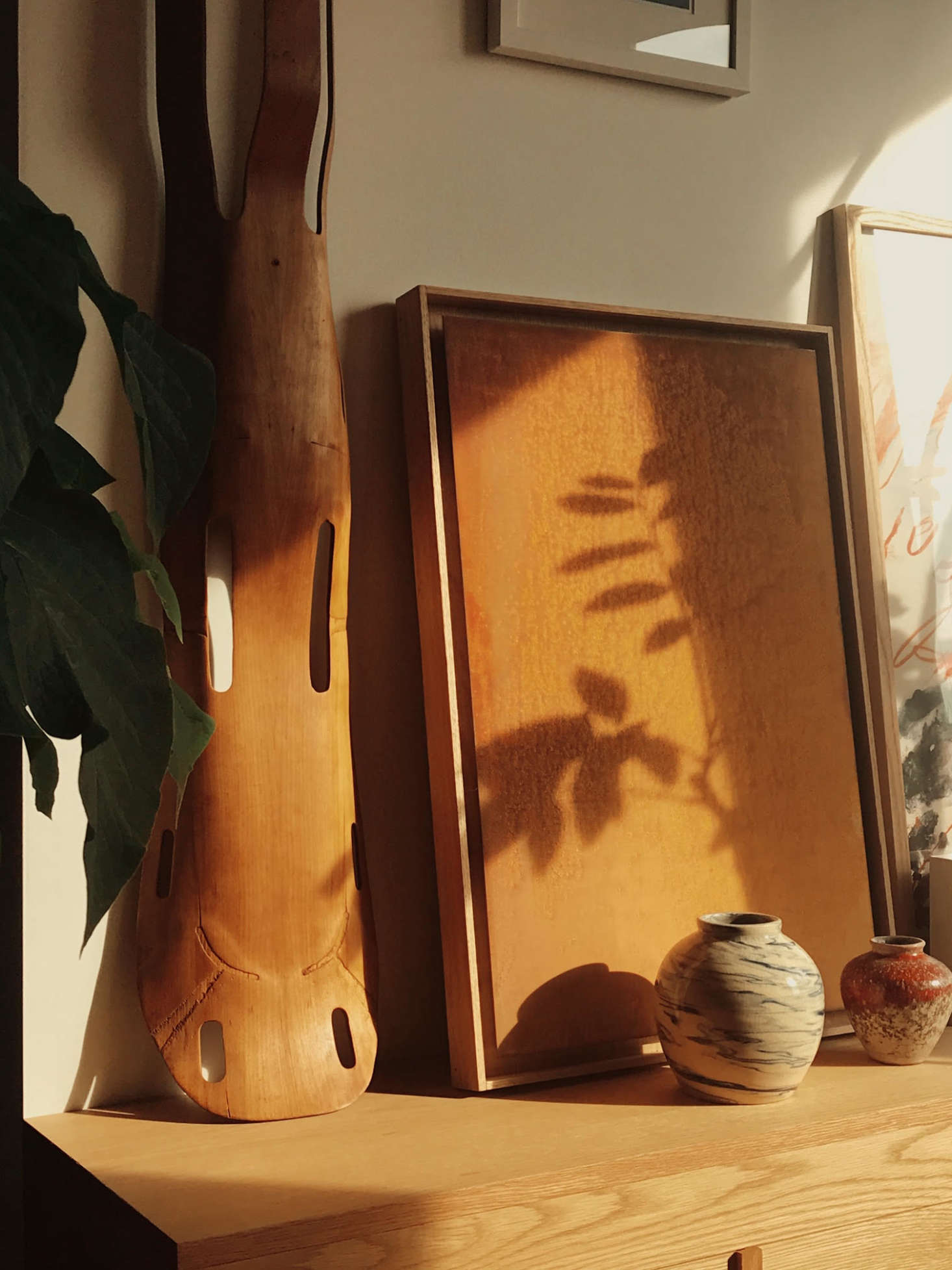 Propped against the wall on the left side of the cabinets is an Eames-designed splint—