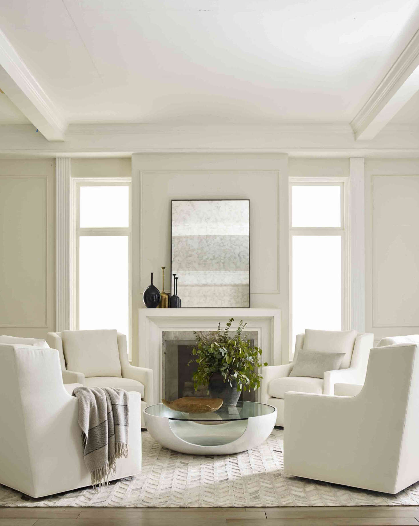 Arranged together or used solo, the Gigi Tall Back Swivel Chairs, shown in Sunbrella performance fabric, make the perfect spot for gathering or for curling up with a book. The Soleil Cocktail Table is shown in white with a silver-leaf interior (and is also available in other finishes).