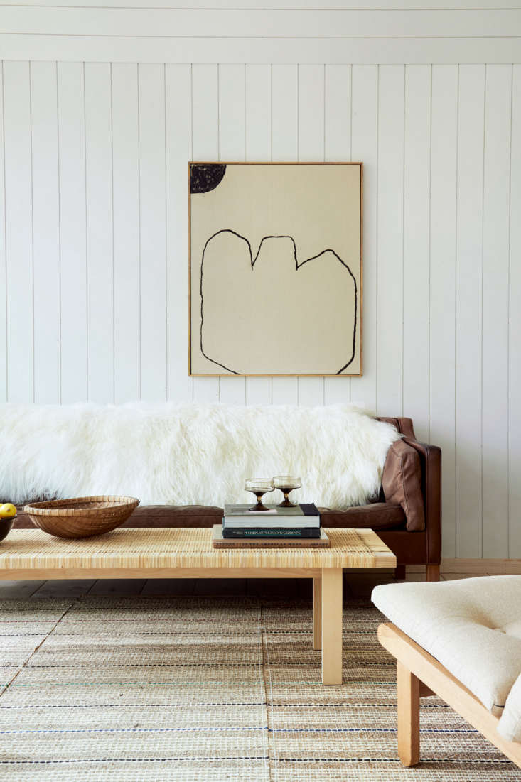 a painting by bertrand fournier hangs above a vintage borge mogensen \2\2\13 so 19