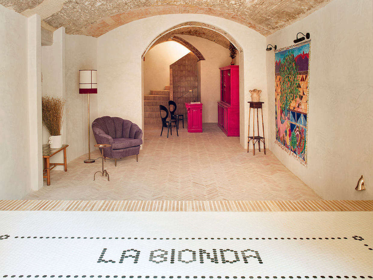 The tiled entry opens to a signature Quintana Partners