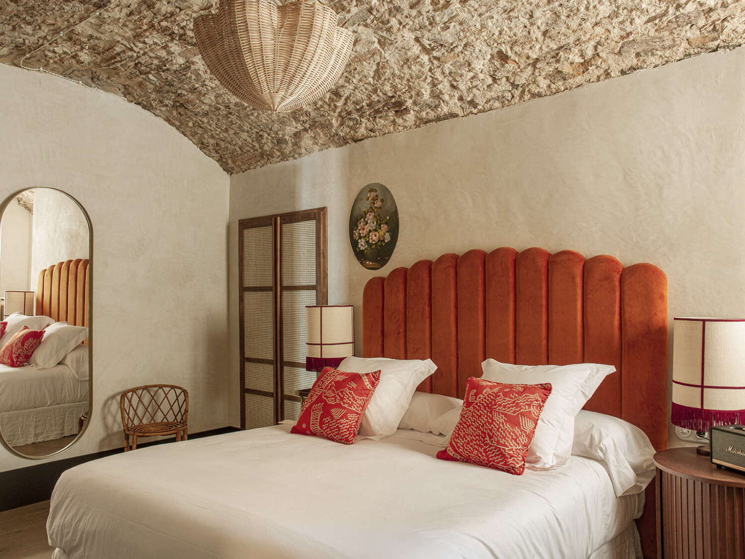 The Charlotte has a stone ceiling and rattan closet stocked with a mini fridge, electric kettle, and beach basket, umbrella, and towels. The Marshall speaker is for listening to your own music and La Bionda