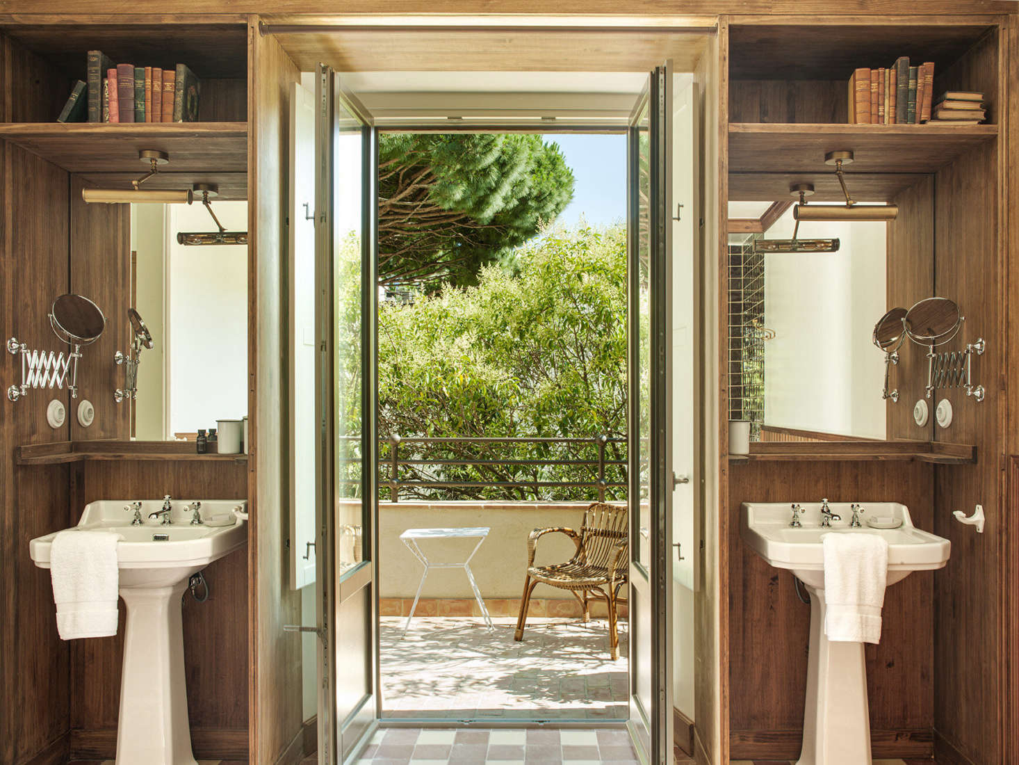 In the Valentina suite, twin sinks flank the door to a private patio.