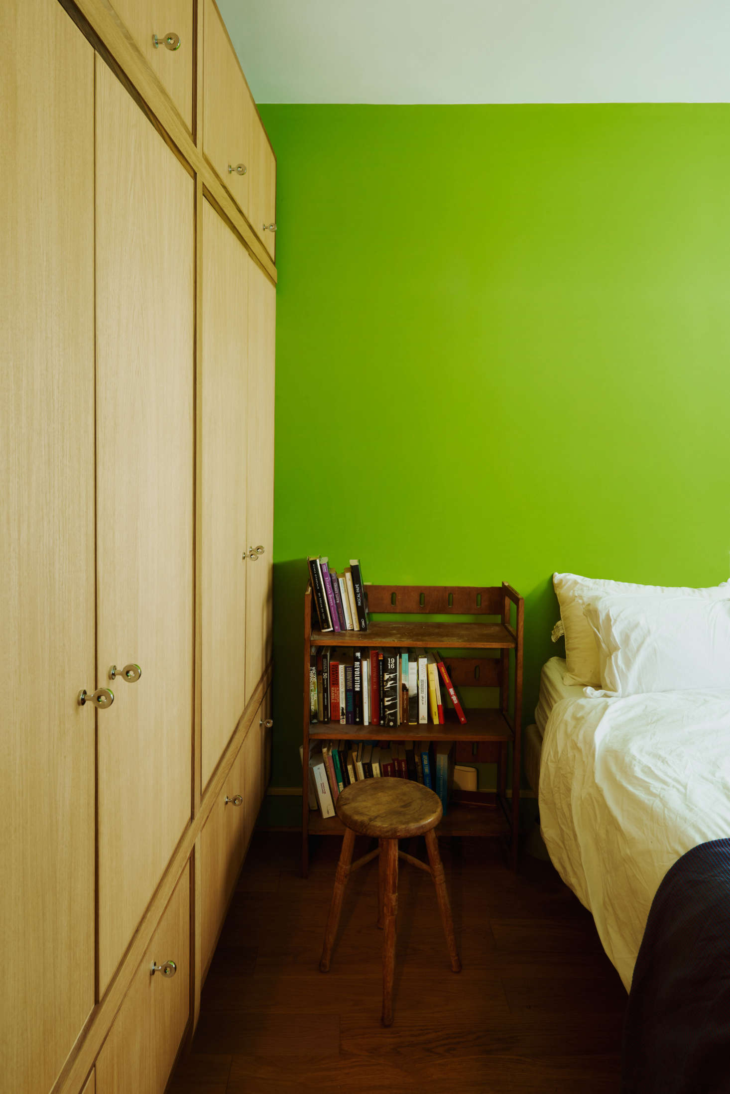 The bedroom, formerly a minty green, is now a bright apple. 