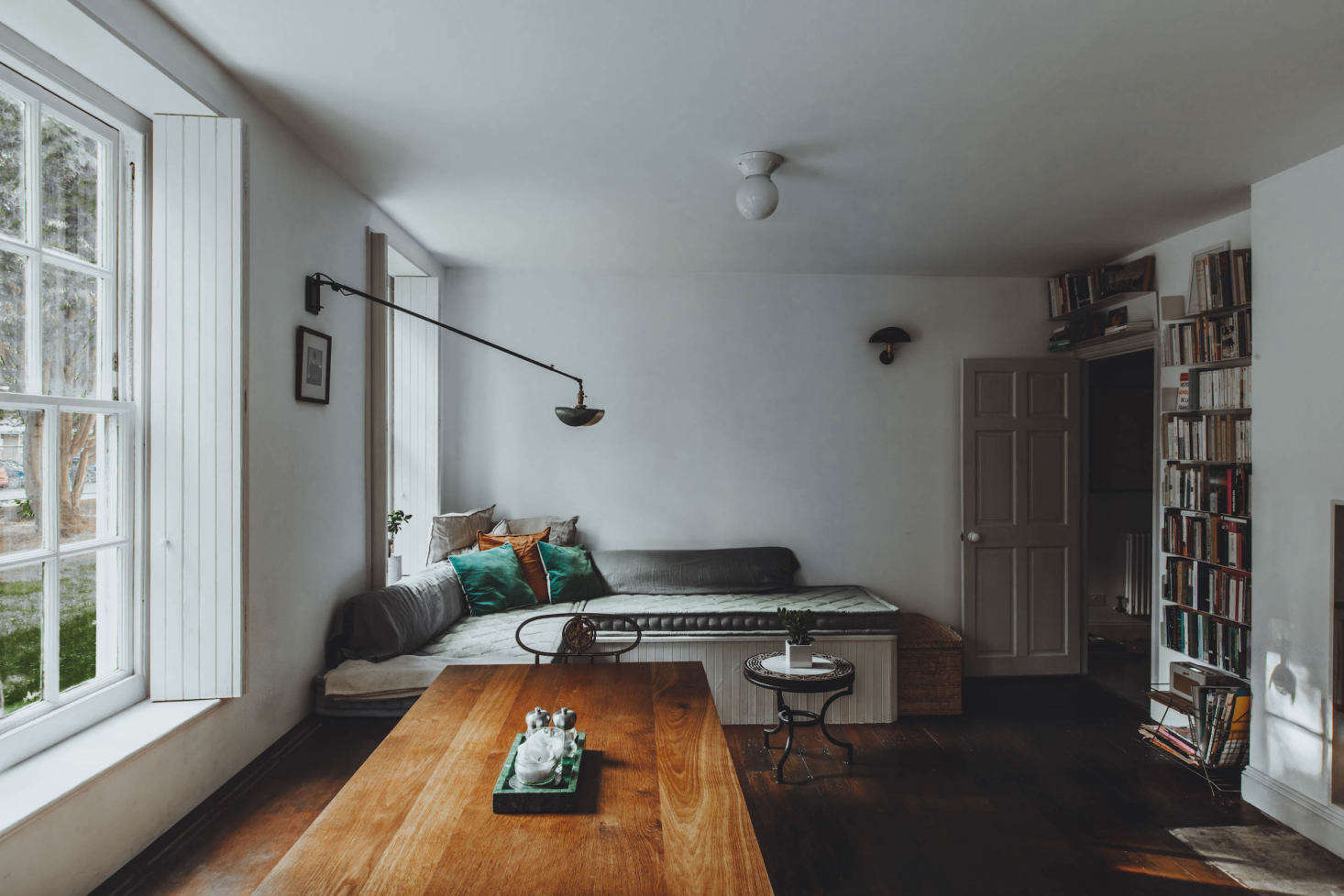 The living area, with a built-in place to read or look out the window and French-made Wo and Wé wall lights. There