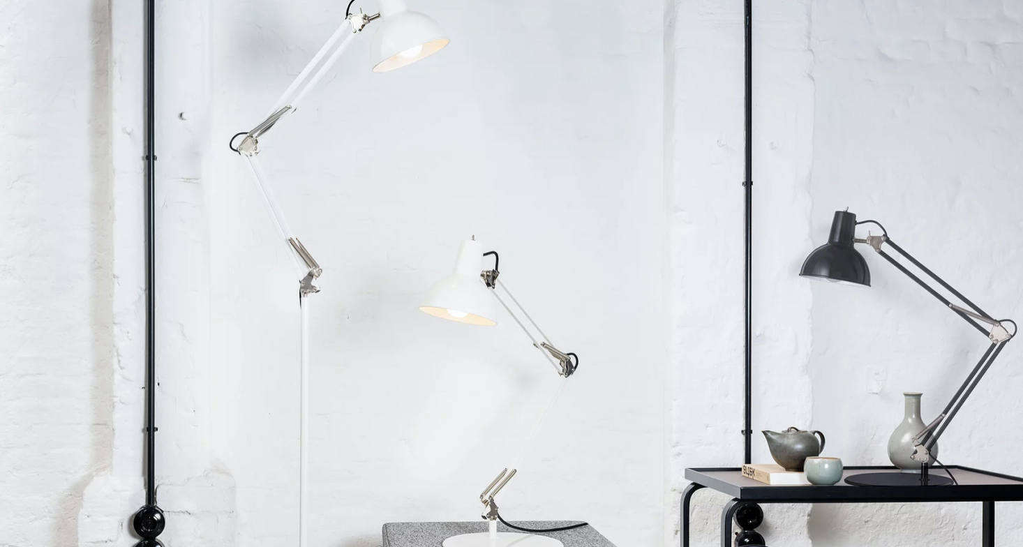 The Spring Balanced lamp has two adjustable arms and is available as a table or floor lamp. The table light has two fixture choices: clamp or free-standing. Standard in black and white (other colors available upon request).