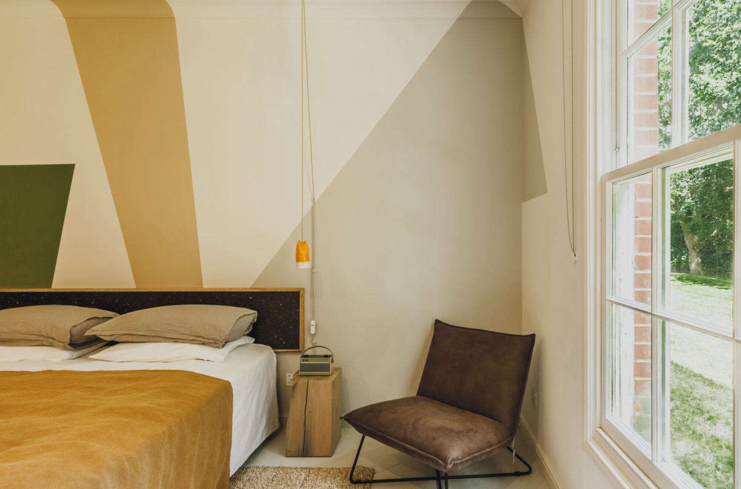 The handmade ceramic bedside lights are by Emma Louise Payne.