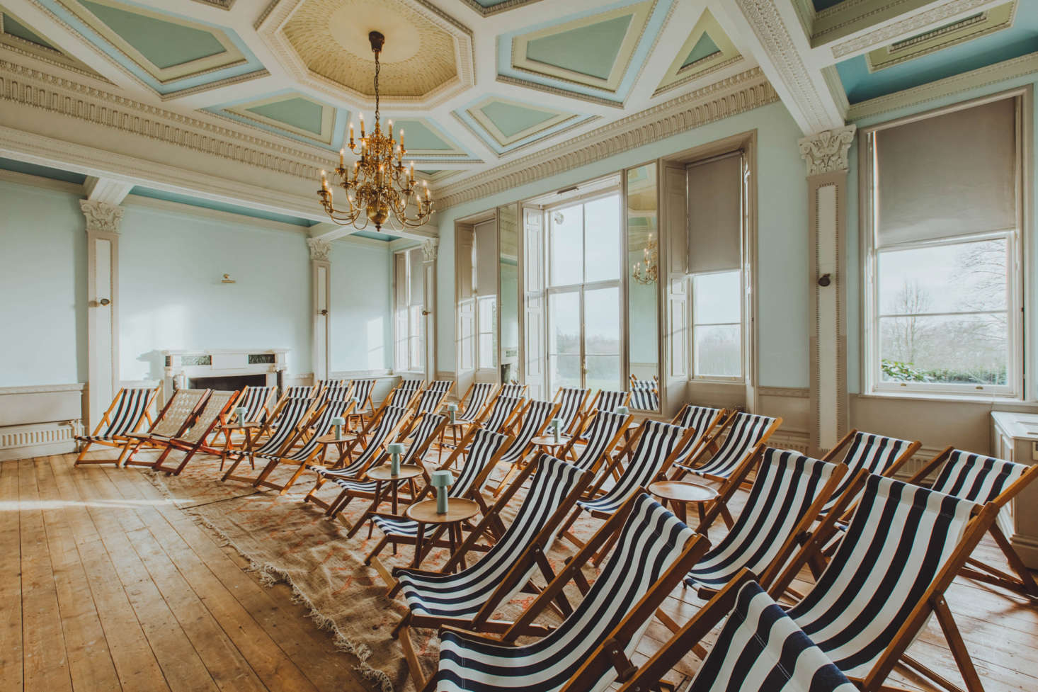 The screening room has rows of striped canvas deck chairs.