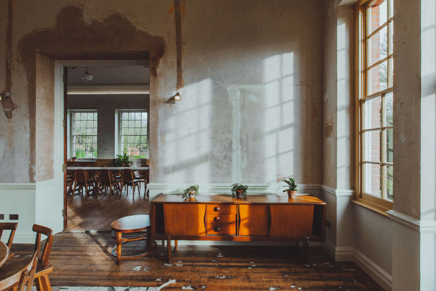 The designers left some of the floors unfinished, preserving original paint spatters.