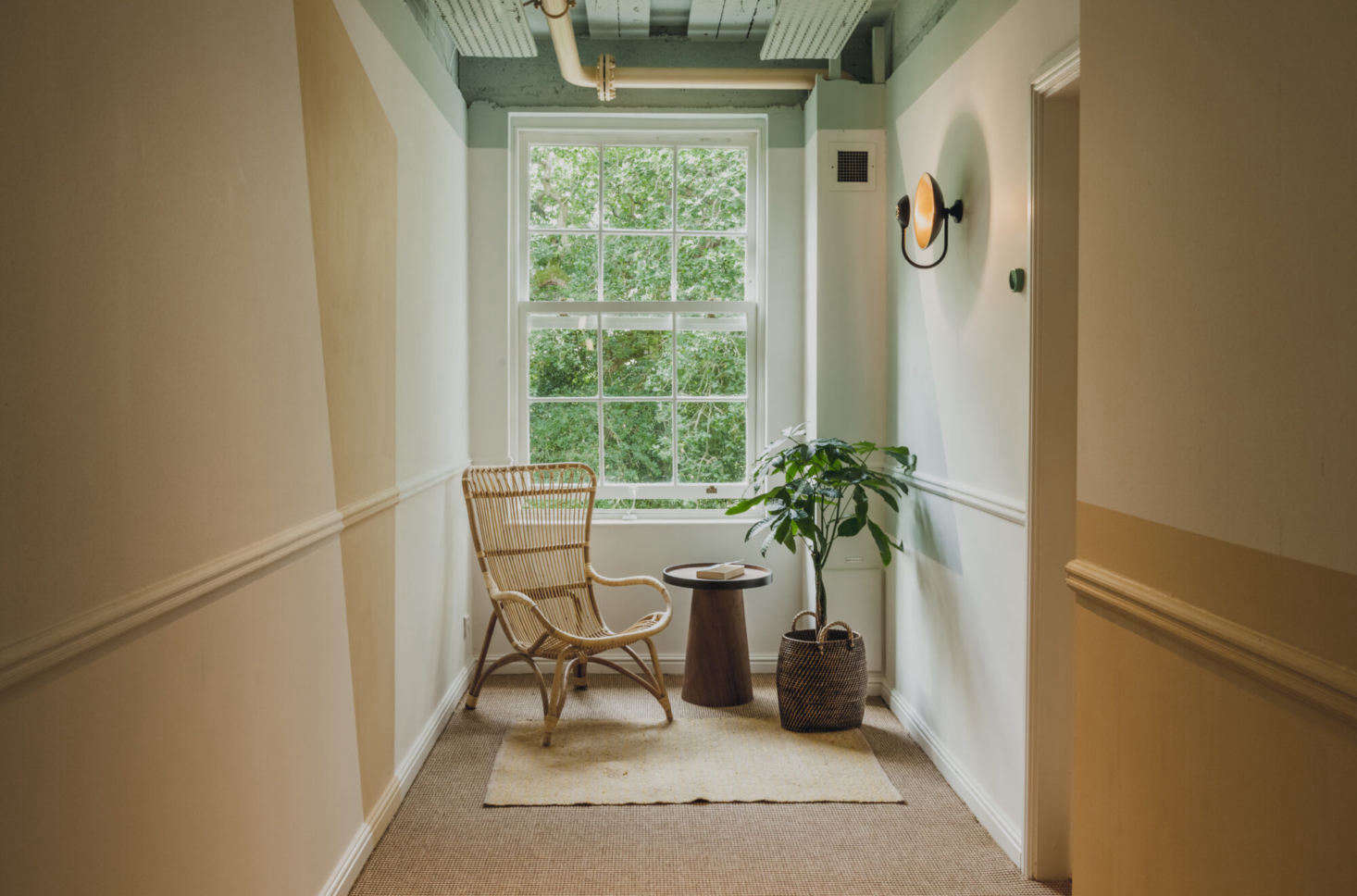 A sunny corner at the end of a hall.