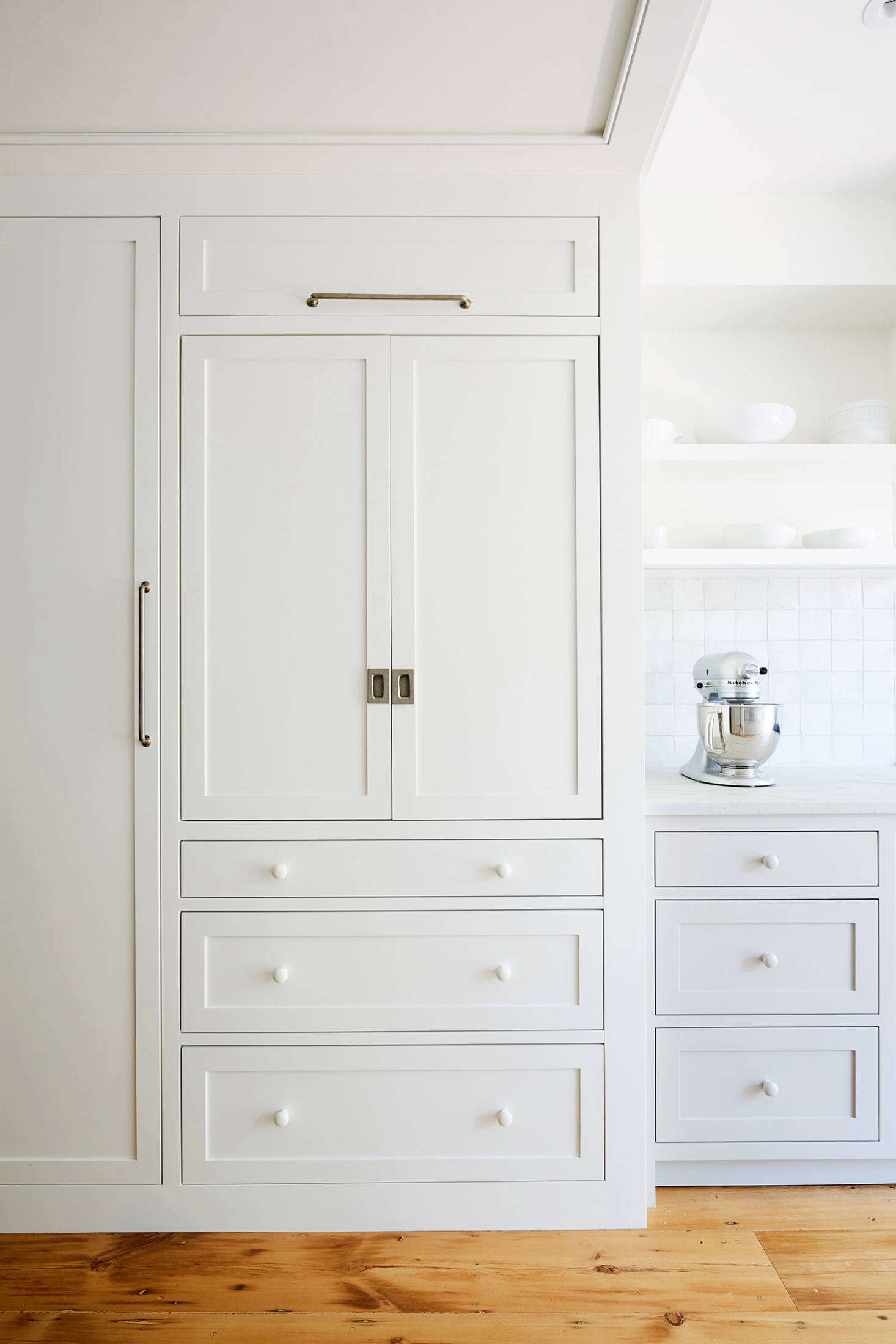During the design process, the owners took a kitchen inventory and the architects mapped out where everything would go. The depth of the transition portal was determined by these needs.