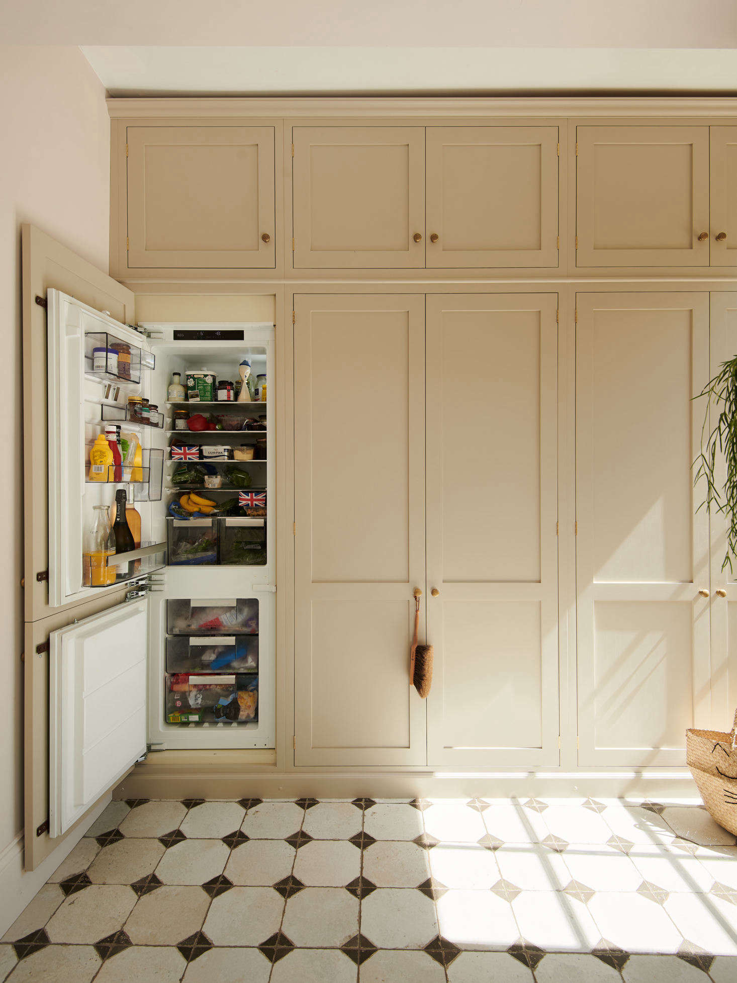 Just off the main kitchen area is a wall of cabinets, painted in deVOL