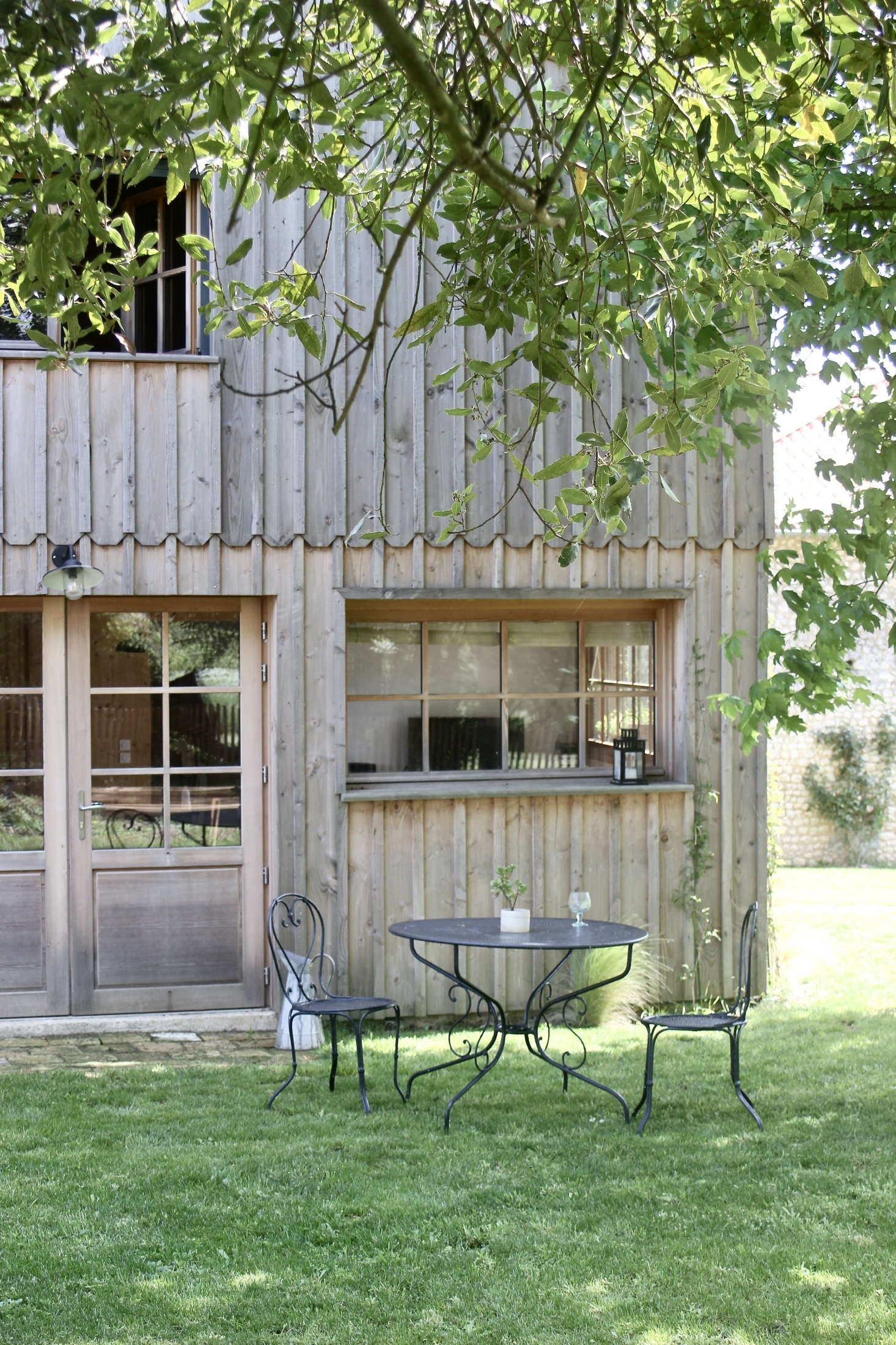 Justine and Jean redesigned what had been a bake house dating from the early th century into a board-and-batten cottage inspired by the fisherman