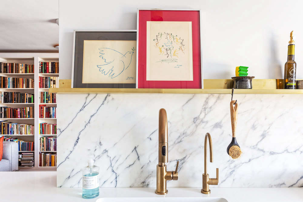 A closeup of the brass delta faucet in the Jackson Heights renovation.
