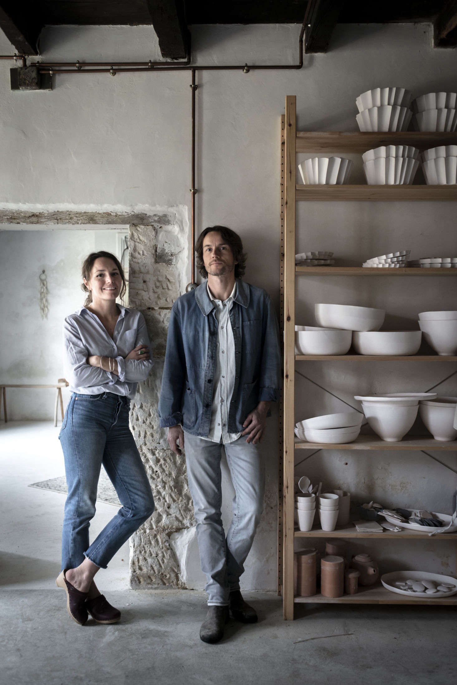 Justine and Jean in their glazing room, newly plastered by Justine
