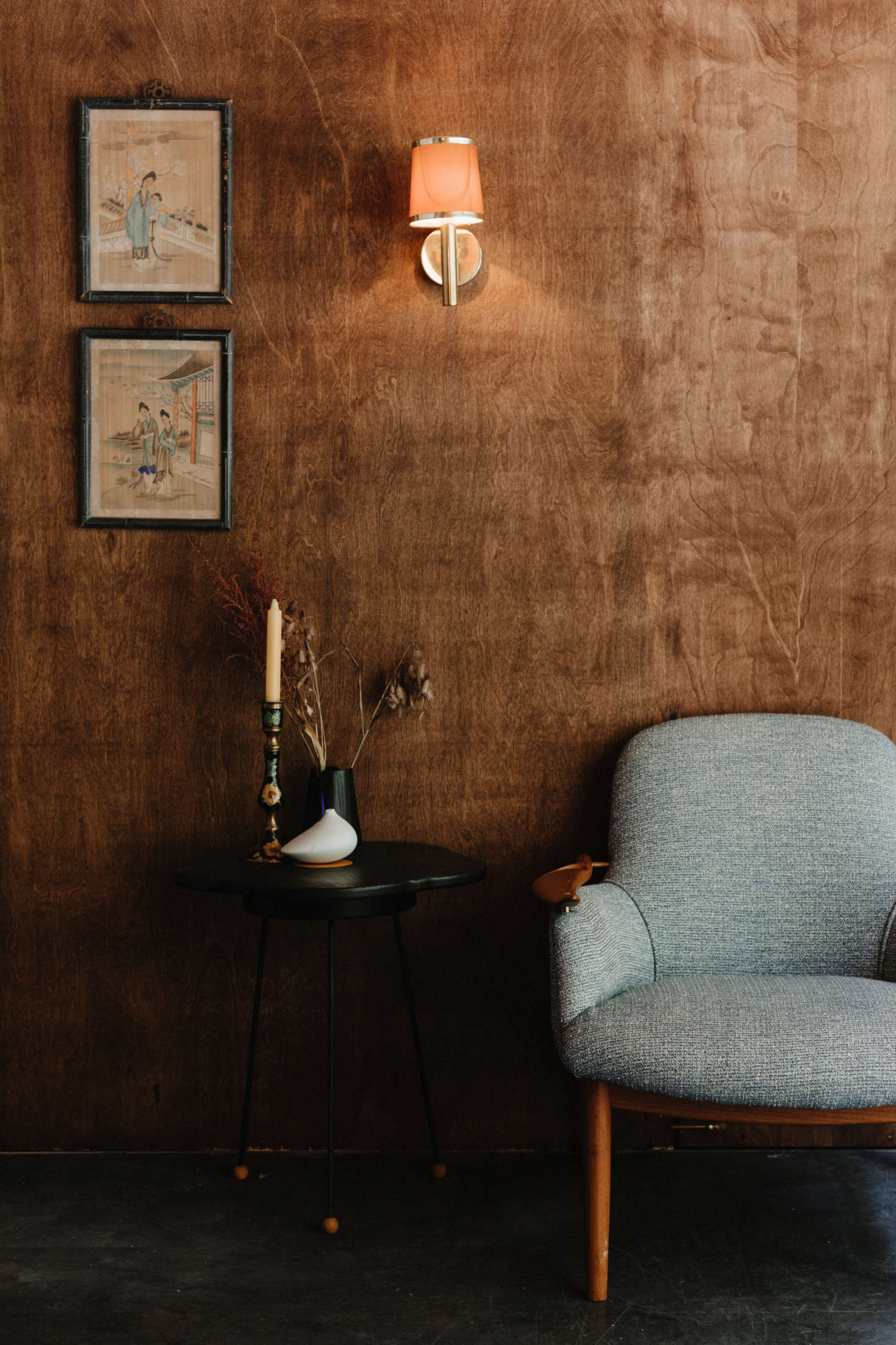 At the opposite end of the space, a 53 Armchair by Finn Juhl and a Poppy Side Table by Julie Jenkinson.