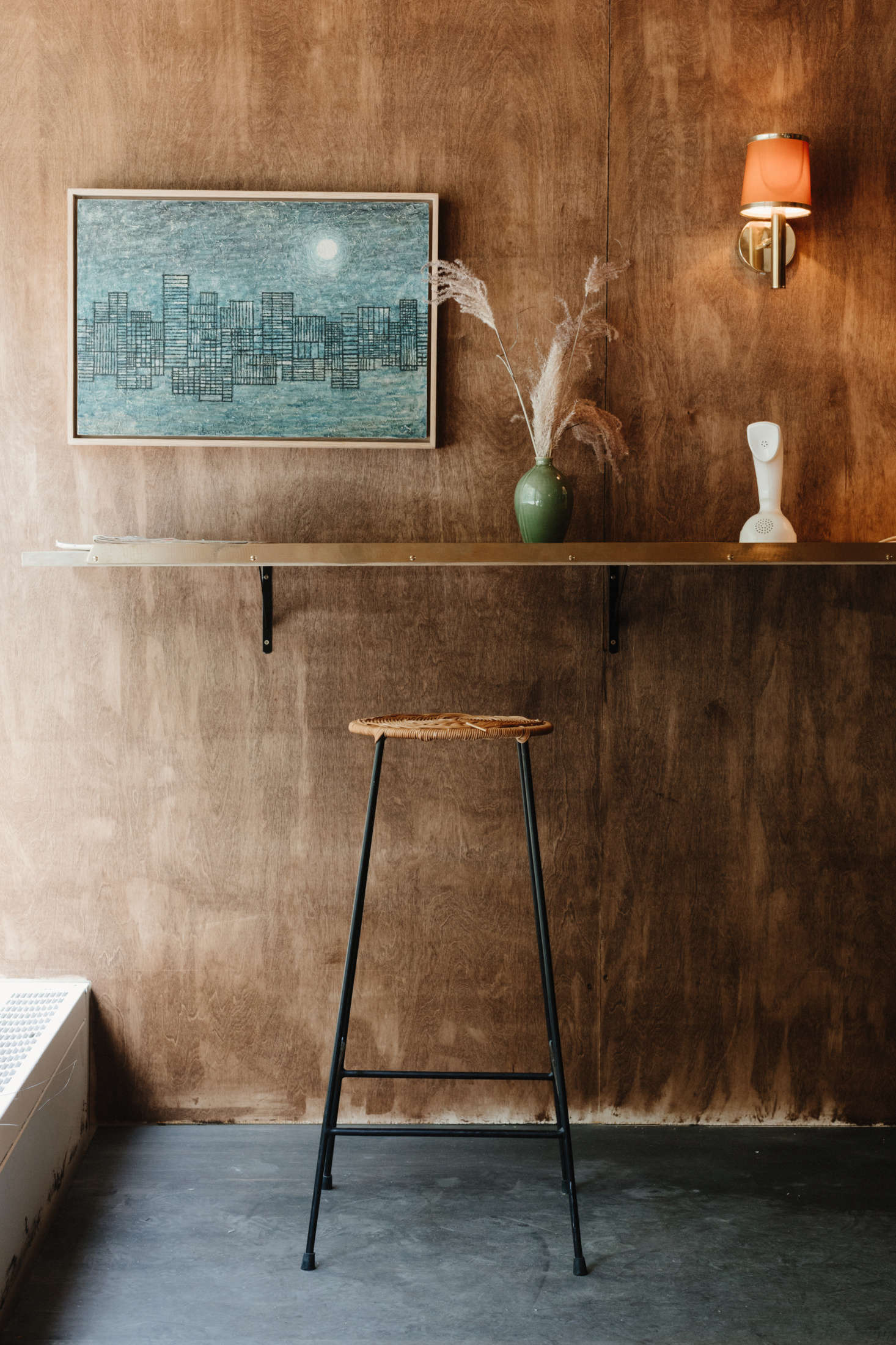 Juli and John found the midcentury Canadian painting and the rattan stool at a vintage shop.