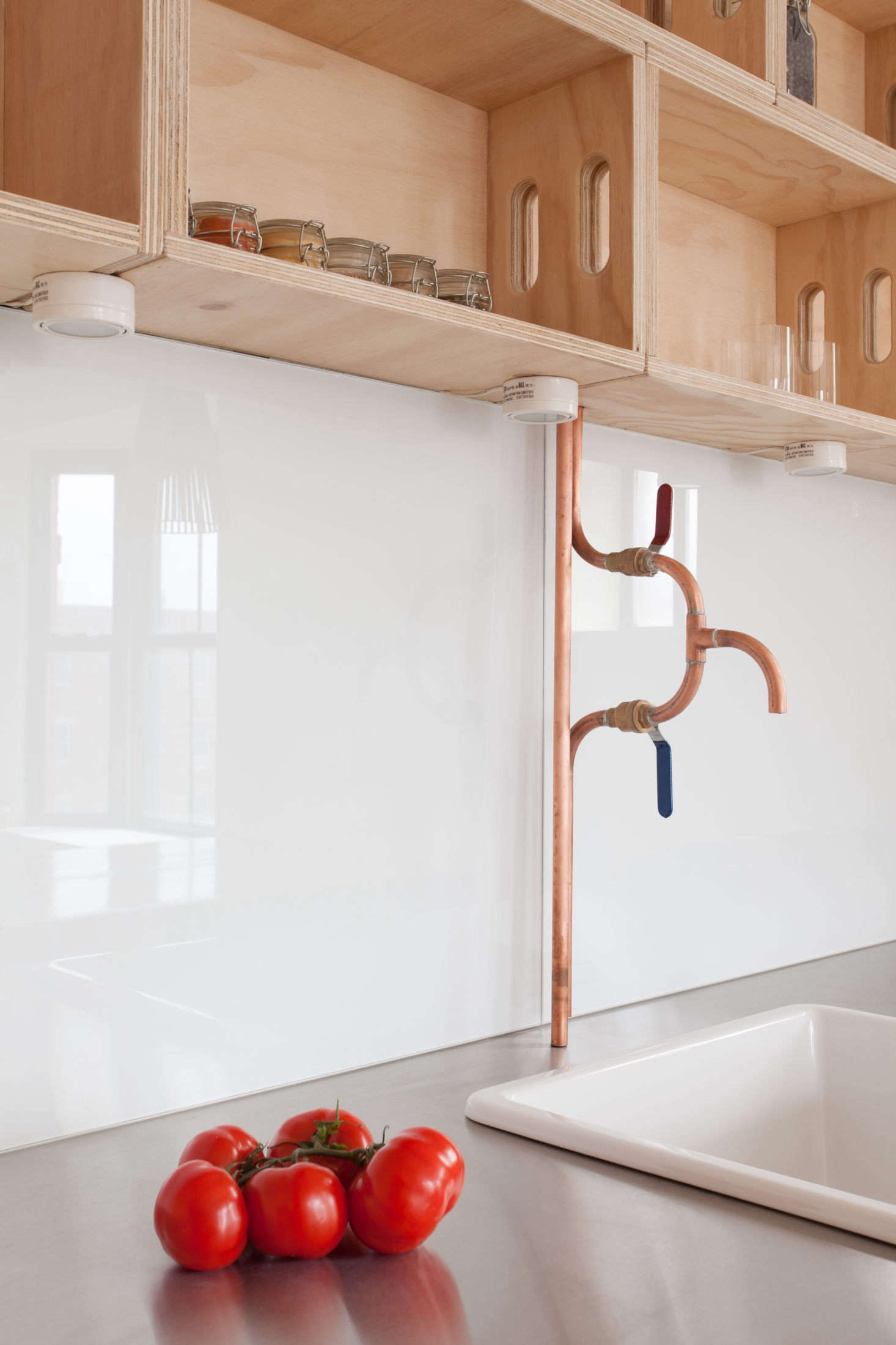The architects had their plumber build the copper piping faucet: 