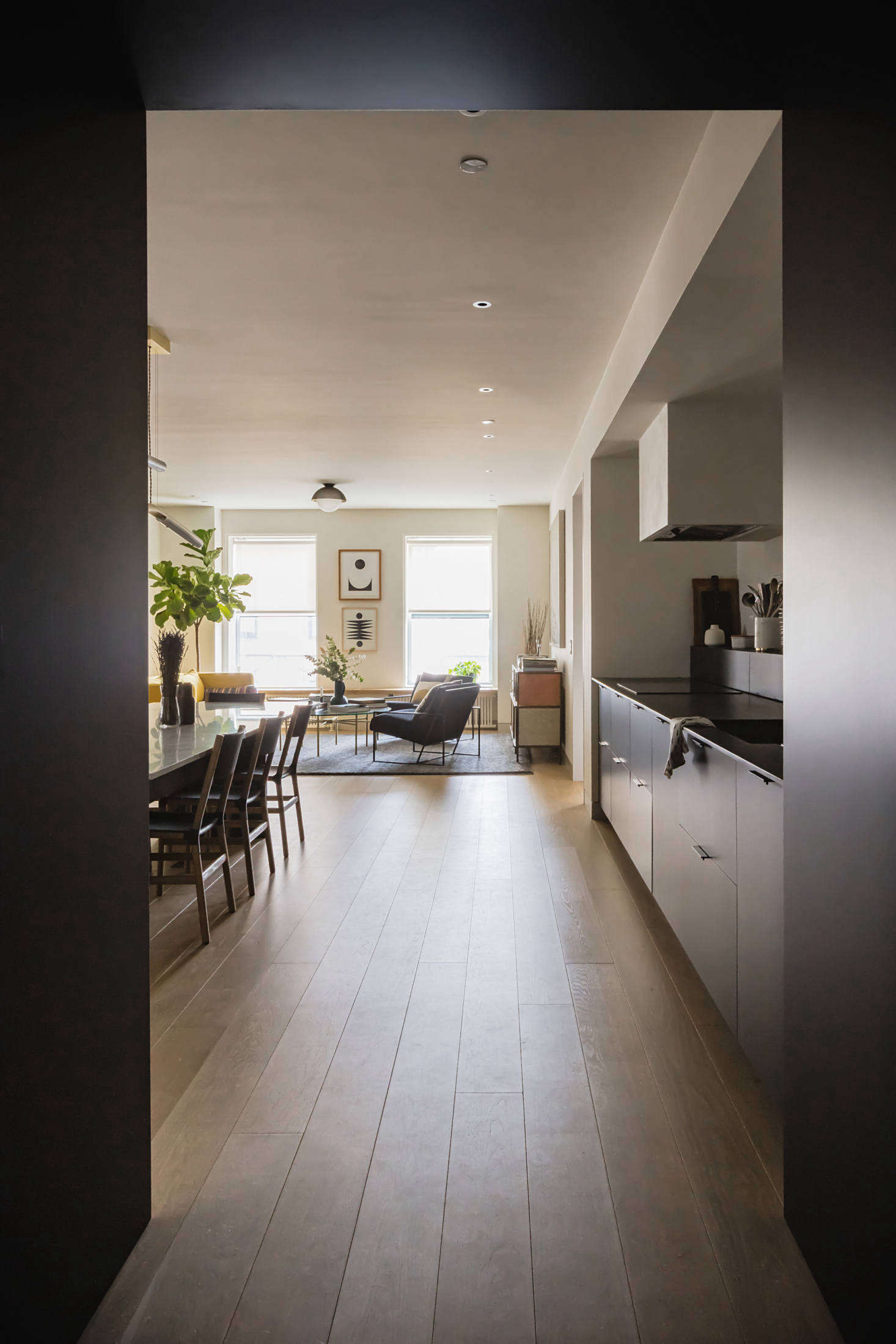 The dark mudroom opens into the bright, open living spaces, which take advantage of the light. 