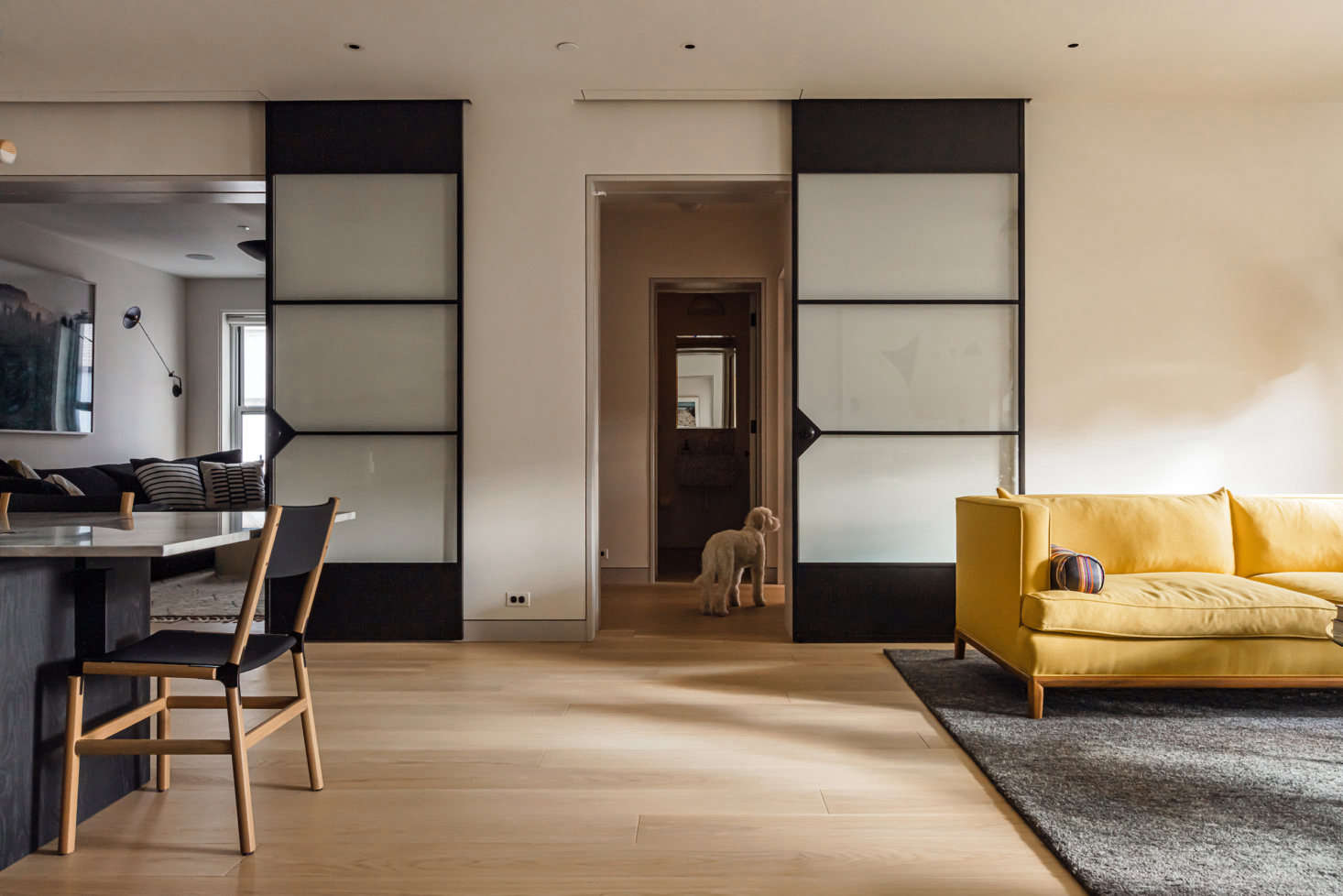 The dining area at left (with a separate family room behind it) and the living room at right. 