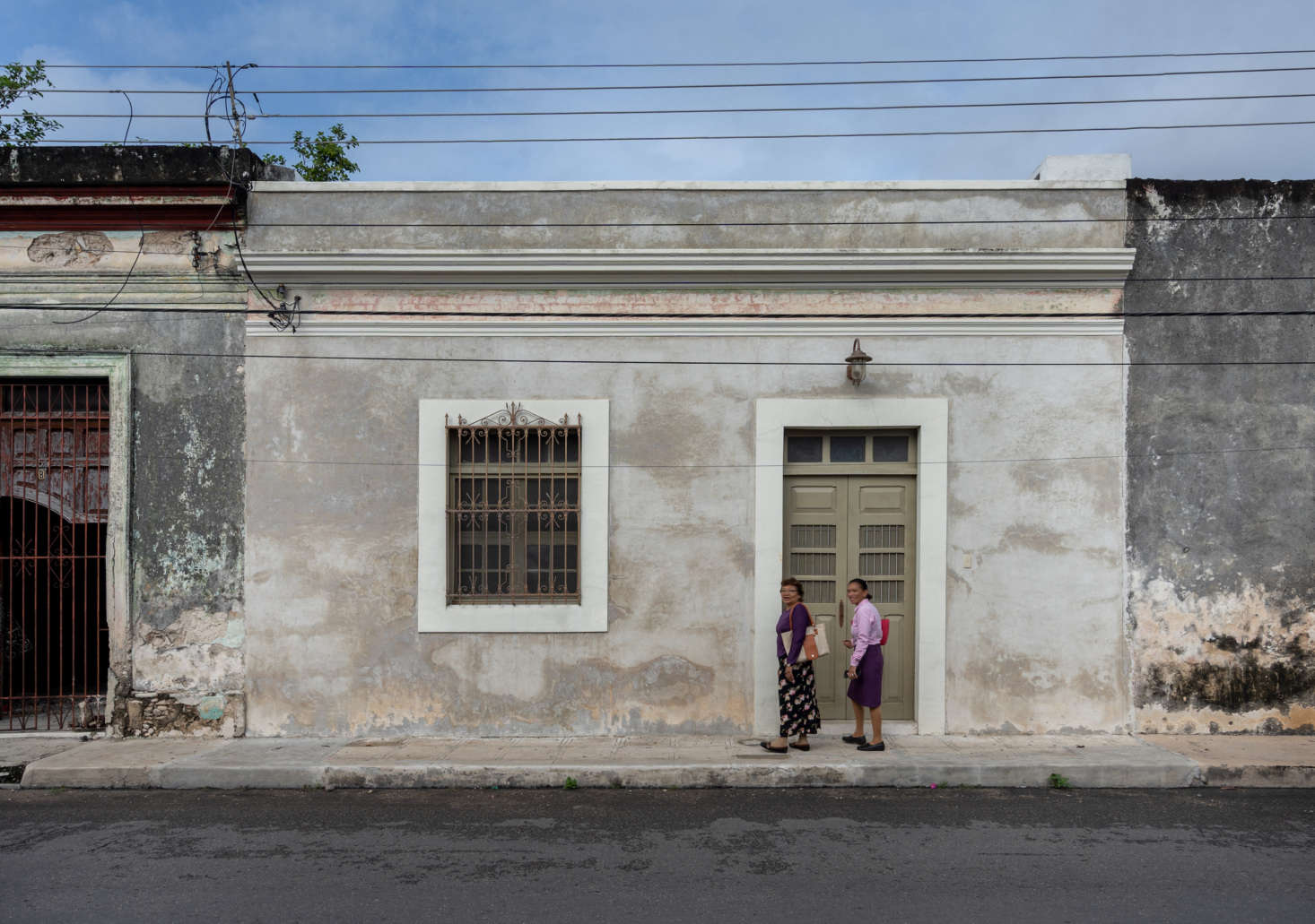 The couple chose to keep the faded facade of Casa Cool, though they had to have a new door built: 