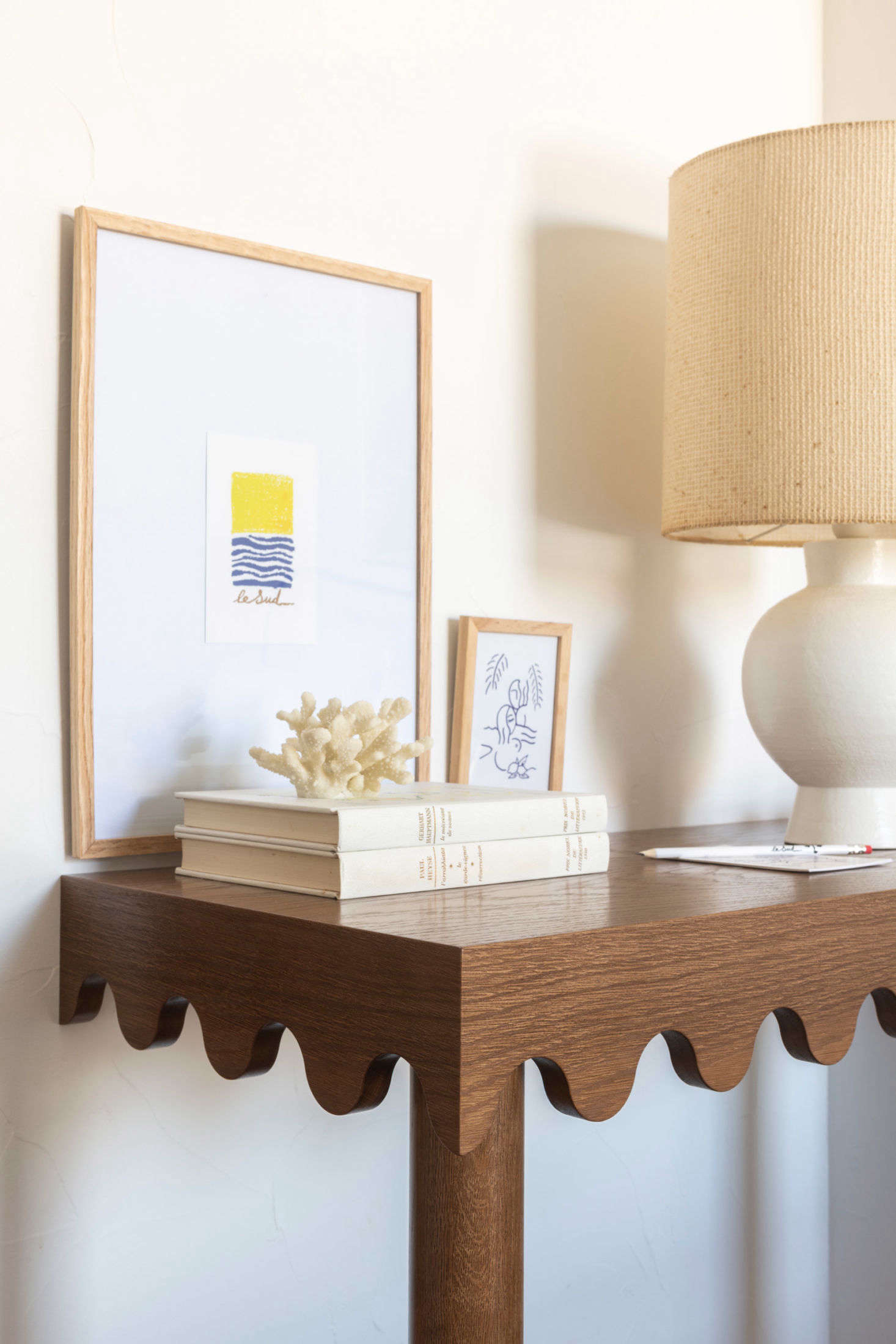 Stéphanie designed the scalloped-edged wooden side tables.