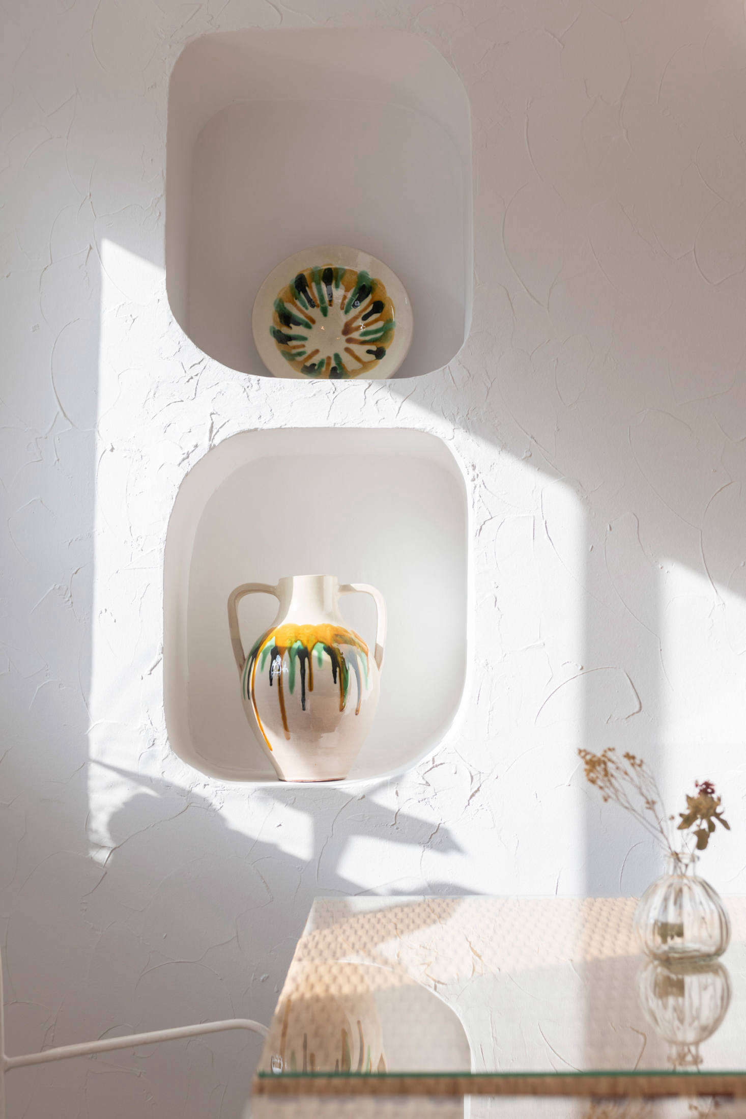 Ceramics sourced locally serve as wall decor.